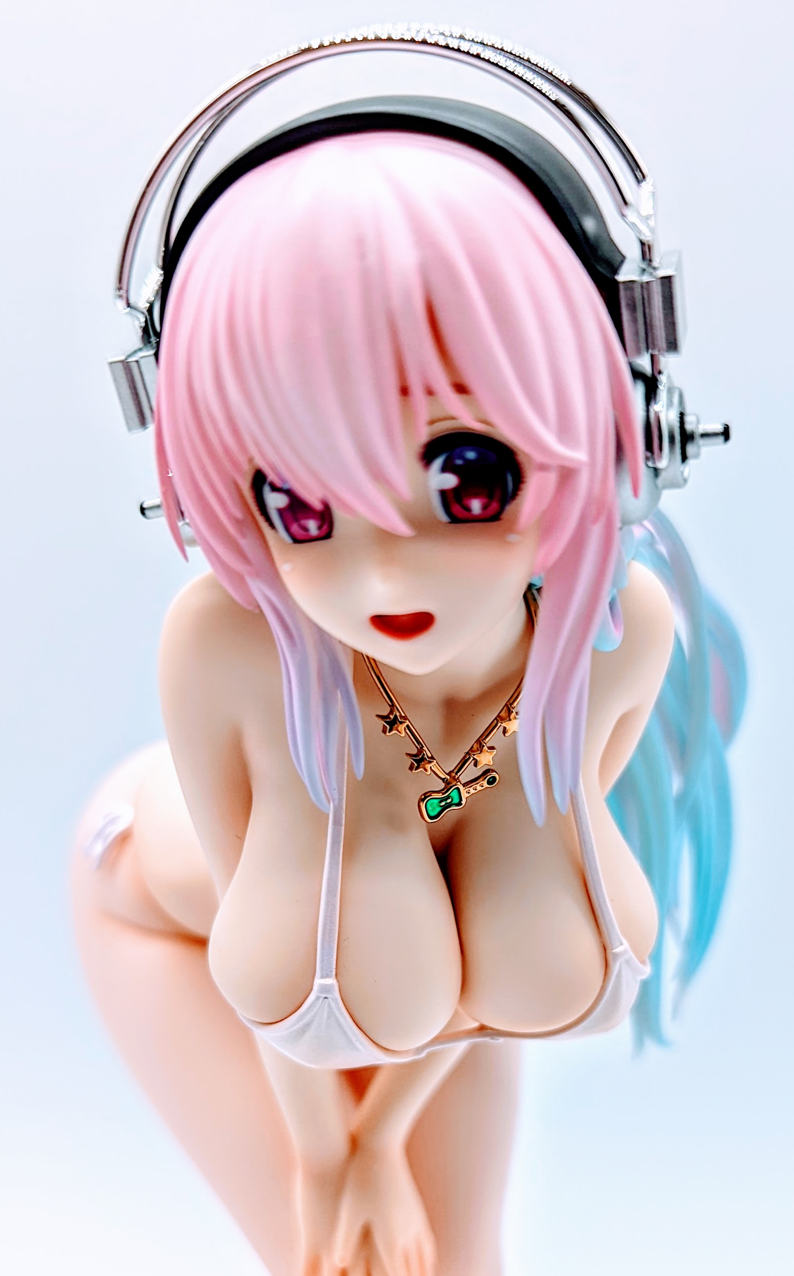 Super Sonico face close-up with bright smile and crisp eyes