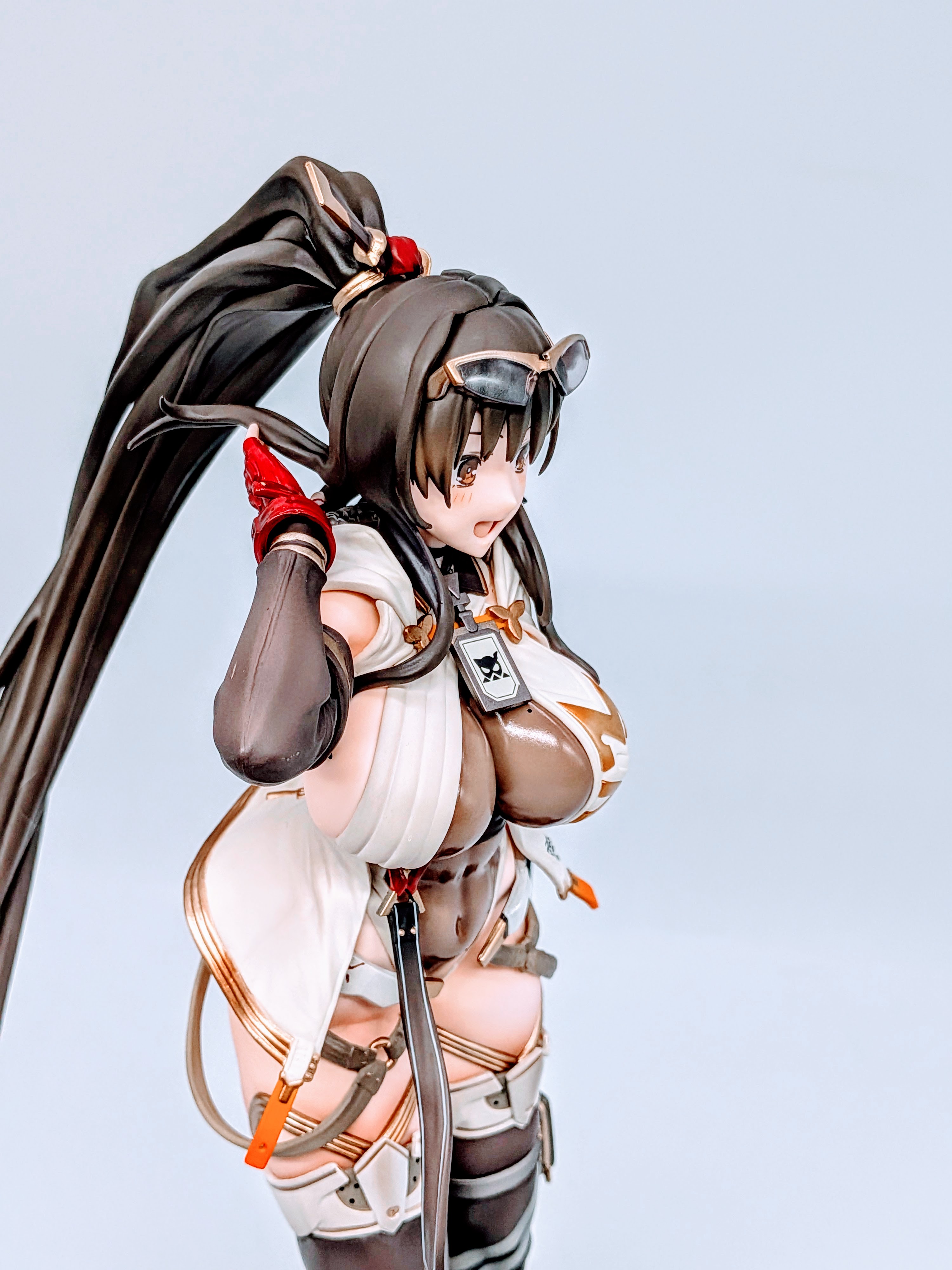 Side close-up of MX-chan figure focusing on torso armor and arm