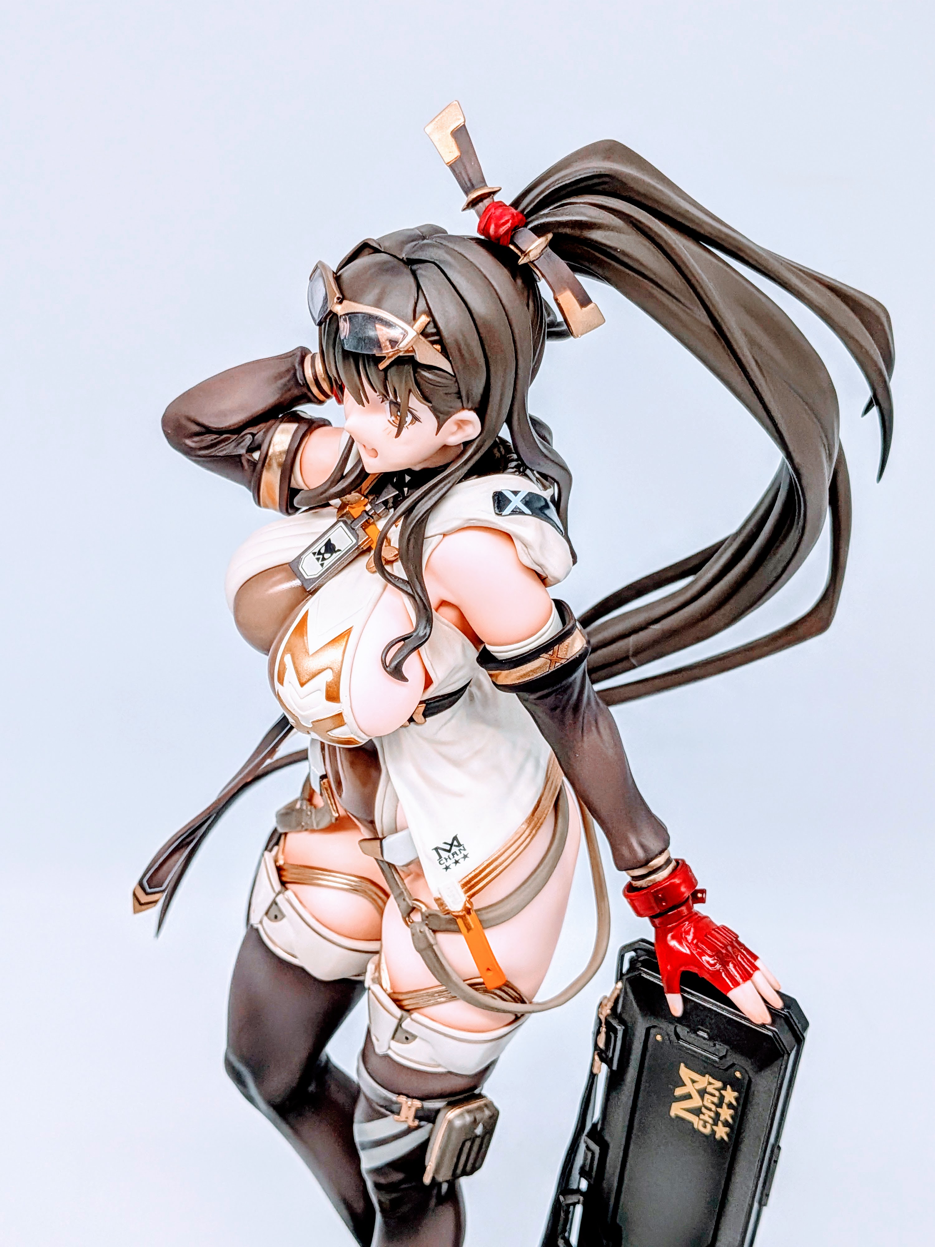 Side close-up of MX-chan thighs and stockings with armor belts