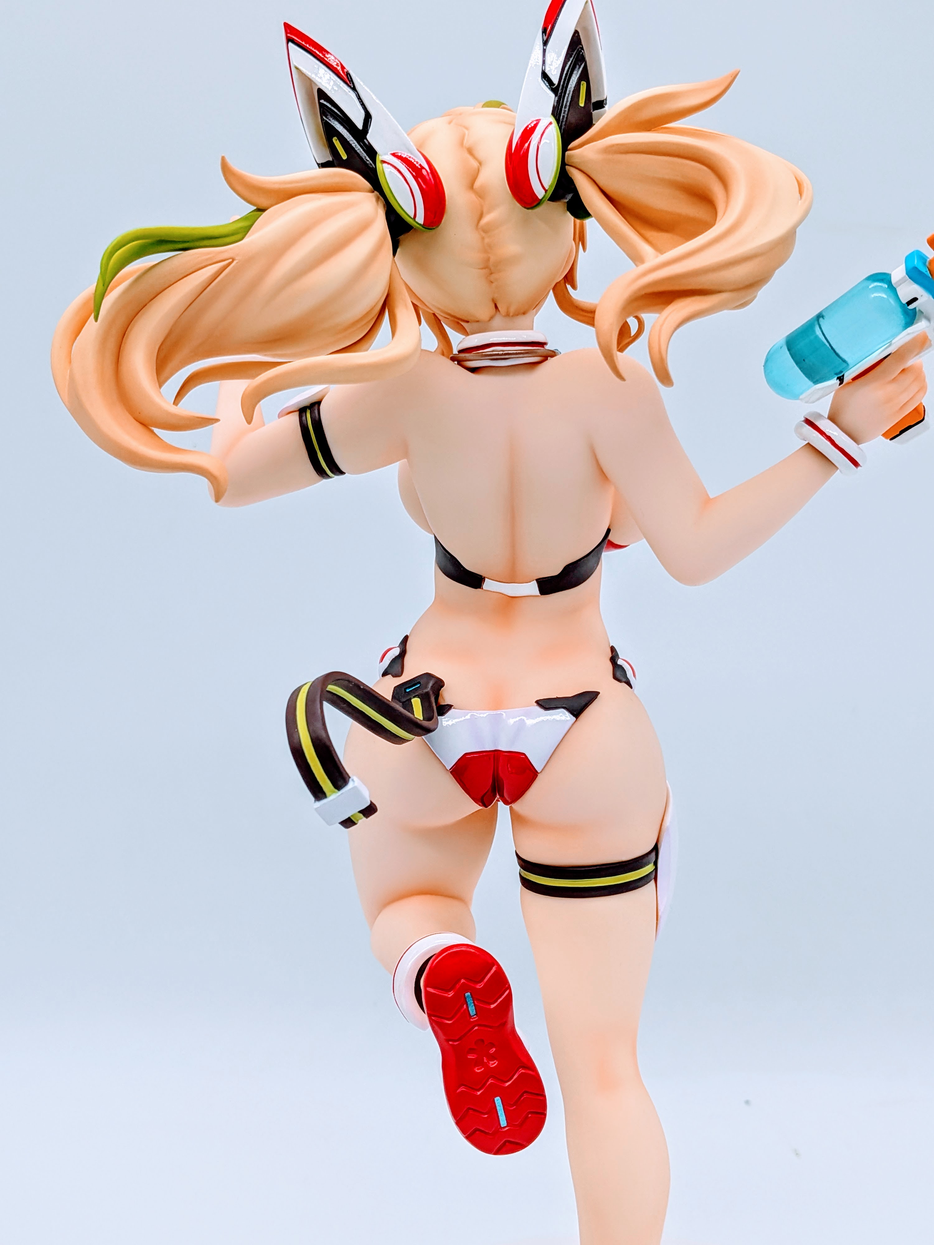 Upper back close-up of Sunshine Gene showing hair and bikini strap