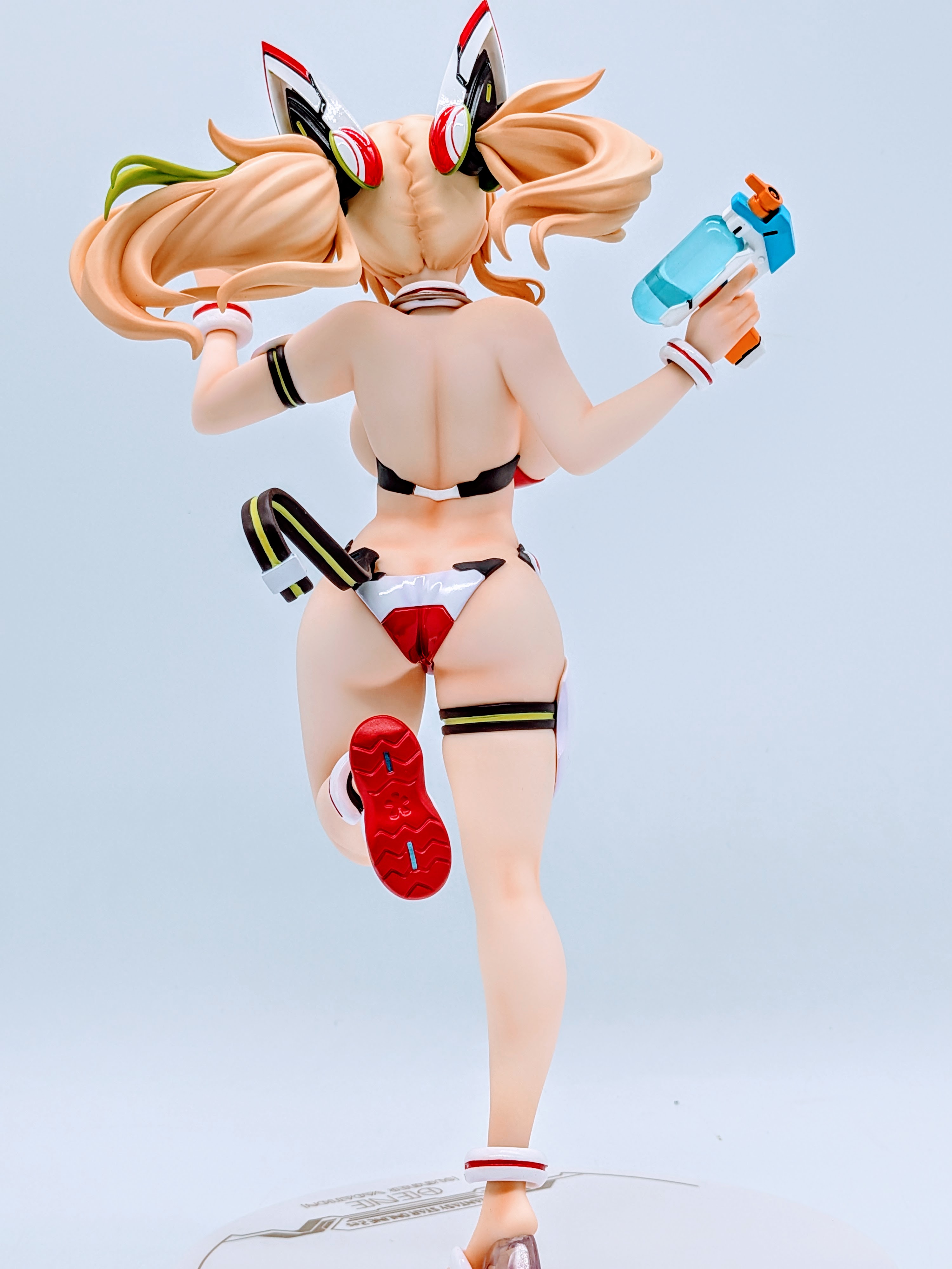 Back close-up of Sunshine Gene hips and swimsuit lines