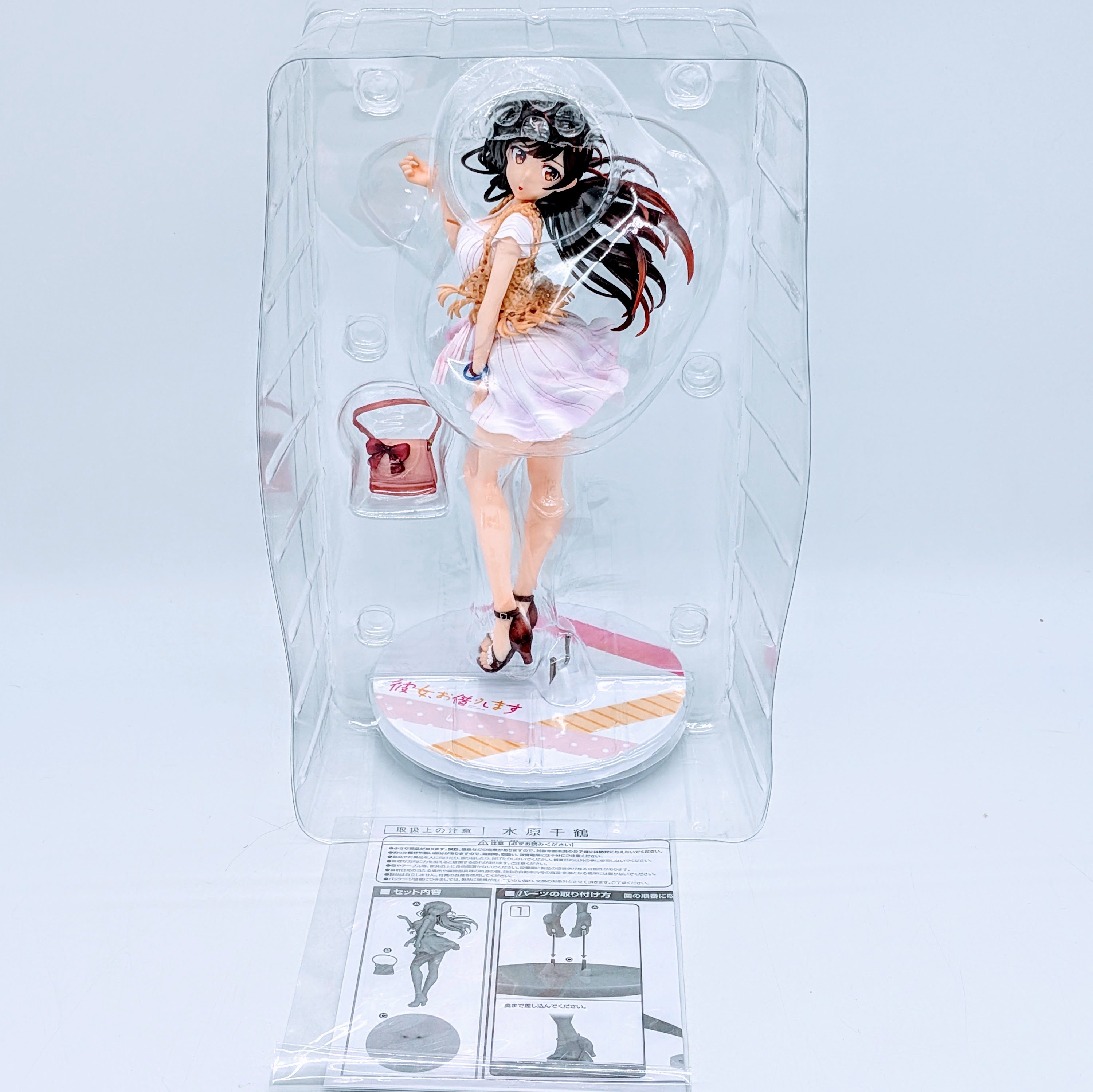 Chizuru Mizuhara figure and base inside the blister after opening the box