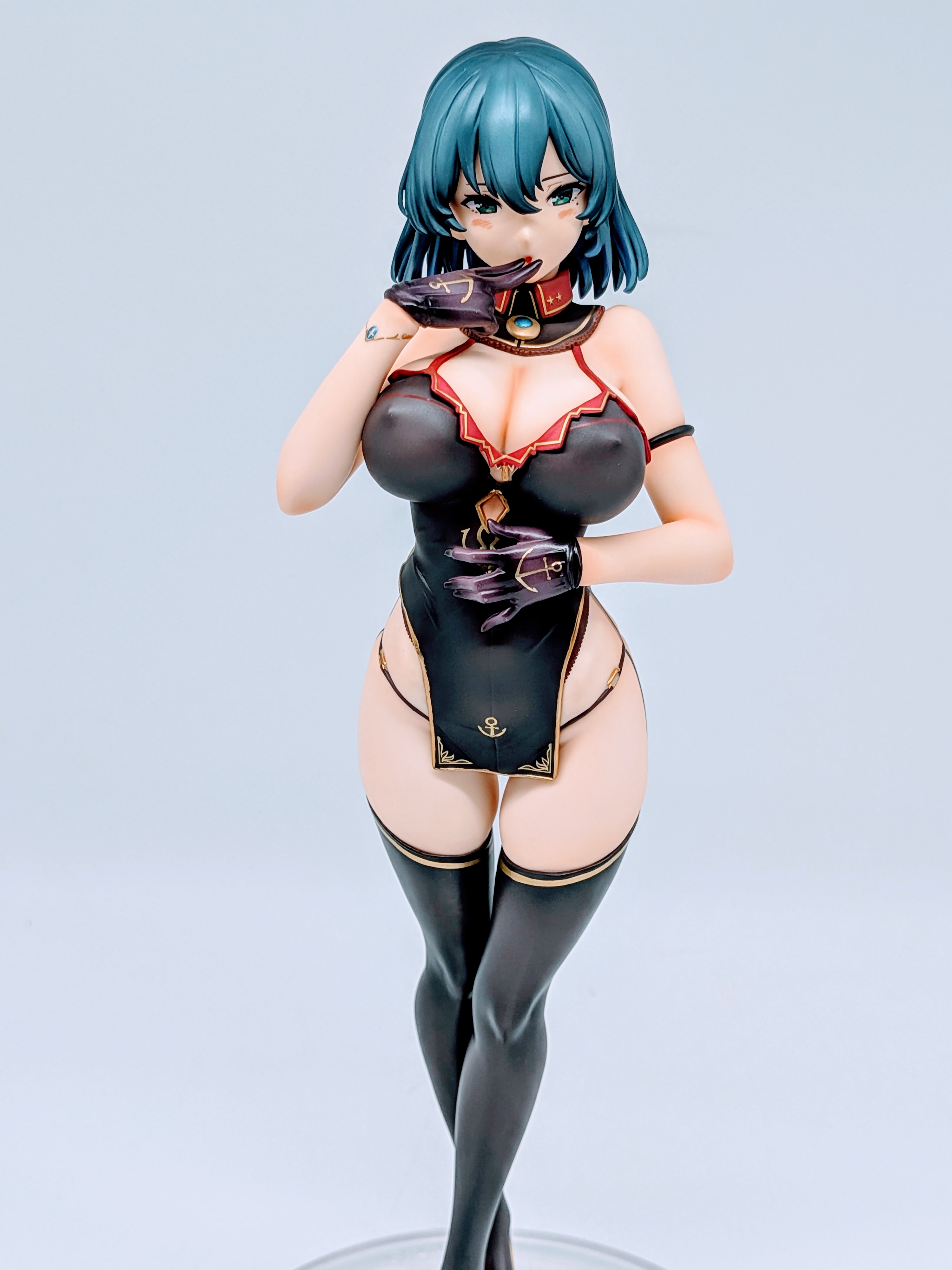 Front close-up of Cattleya figure showing face, naval hat and epaulettes