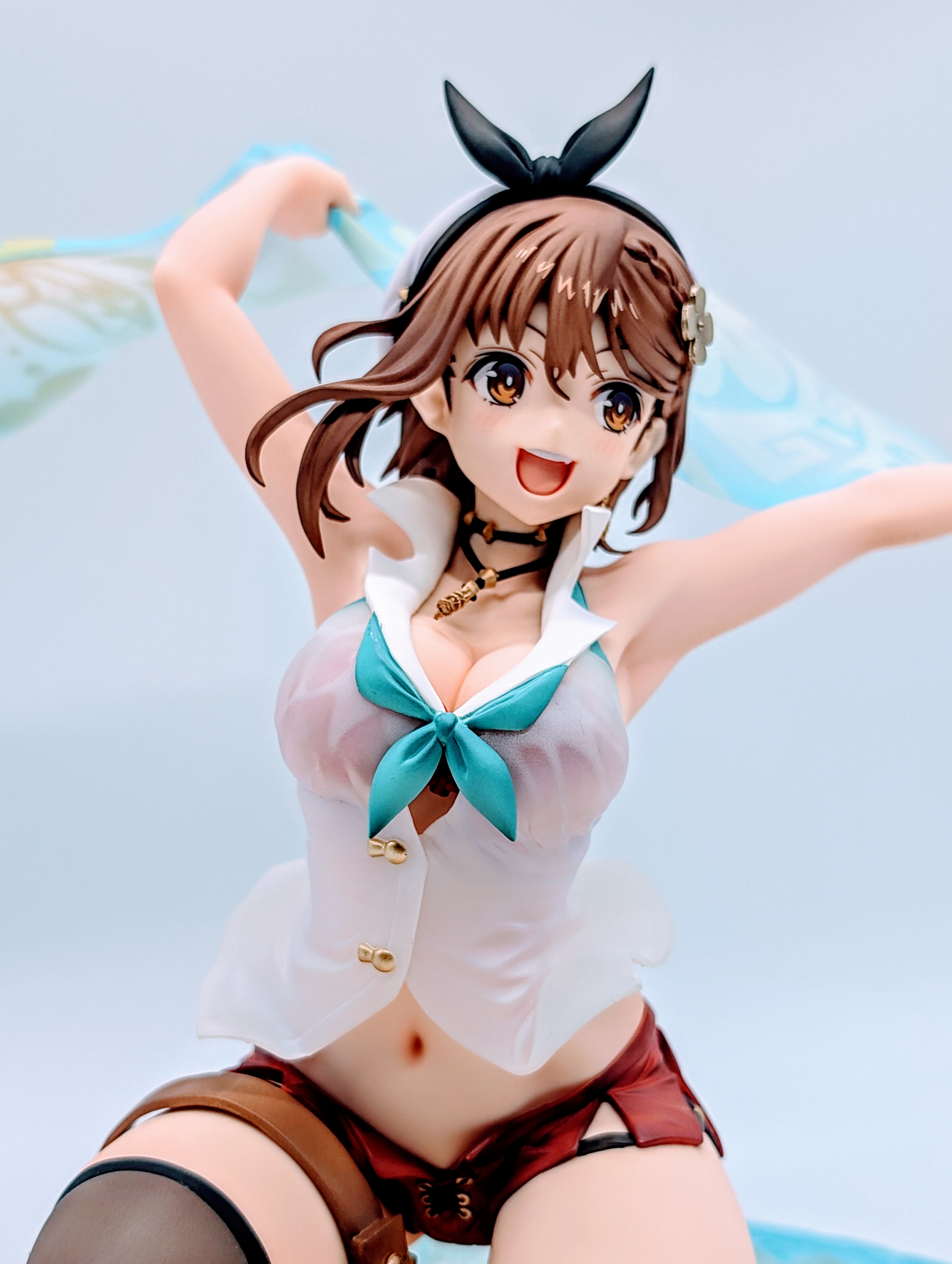 Bust close-up of Ryza showing her big chest under a wet translucent shirt