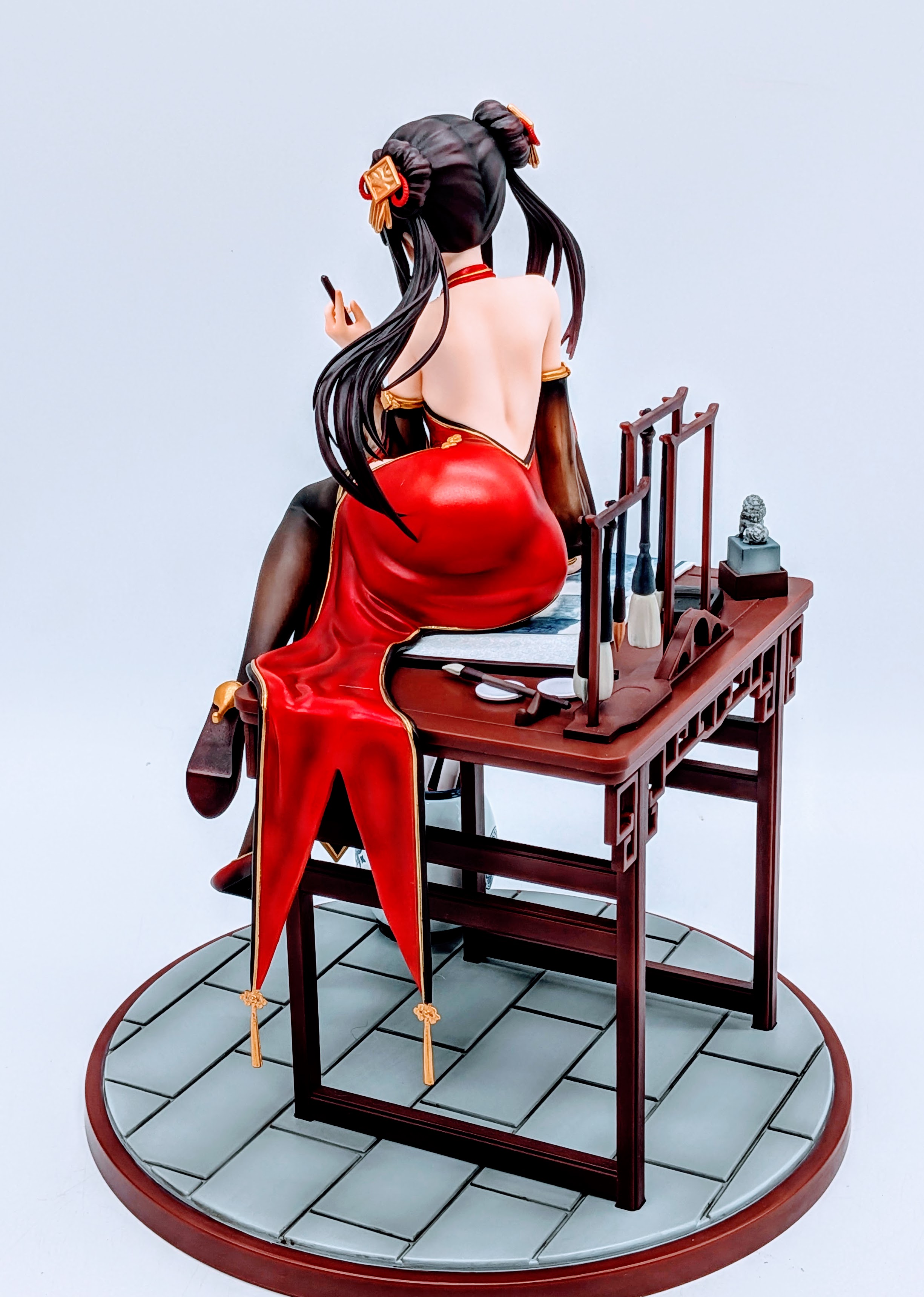 Rear three-quarter full view of Kurumi Tokisaki figure showing dress and legs