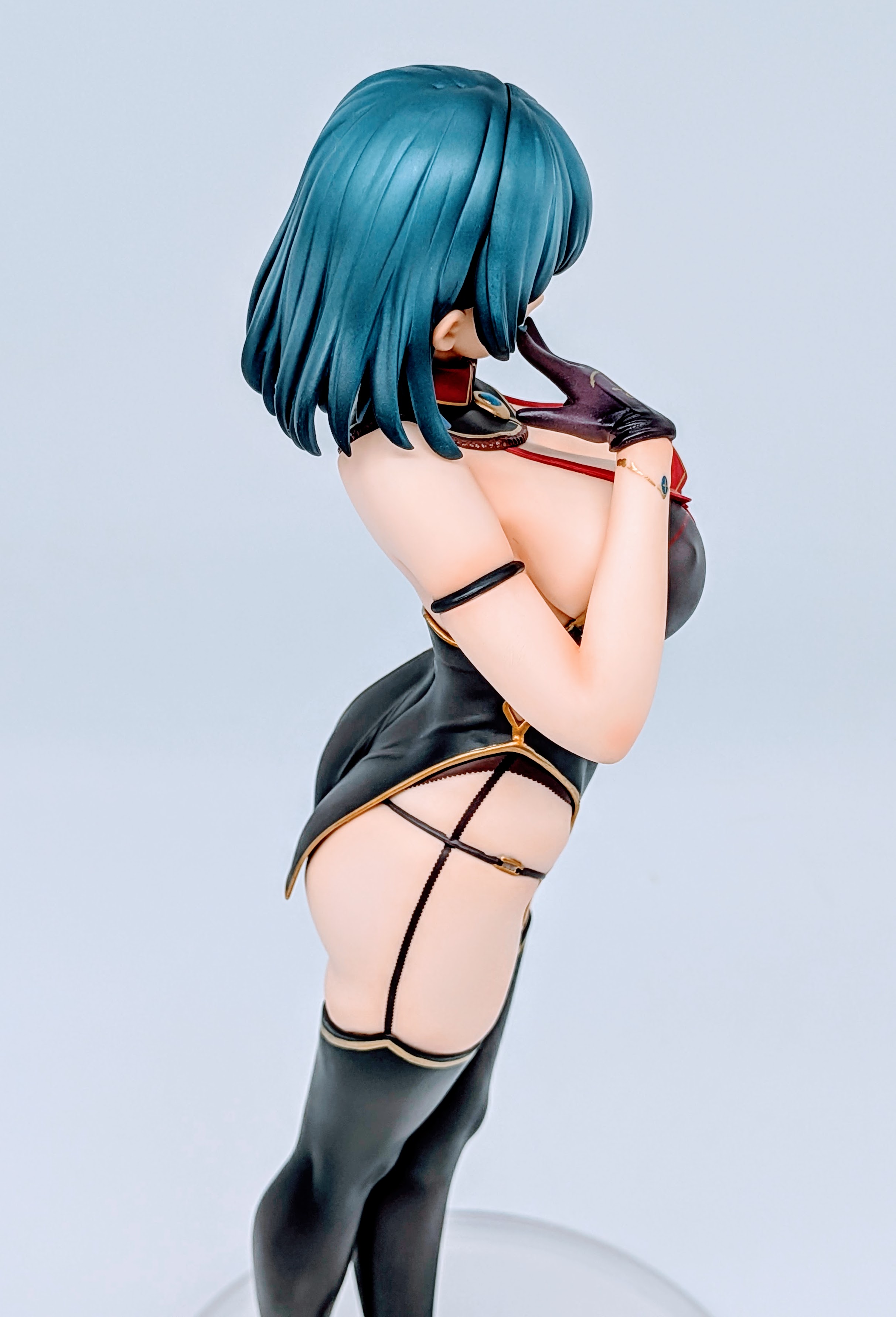 Side bust close-up of Cattleya showing chest profile and jacket line