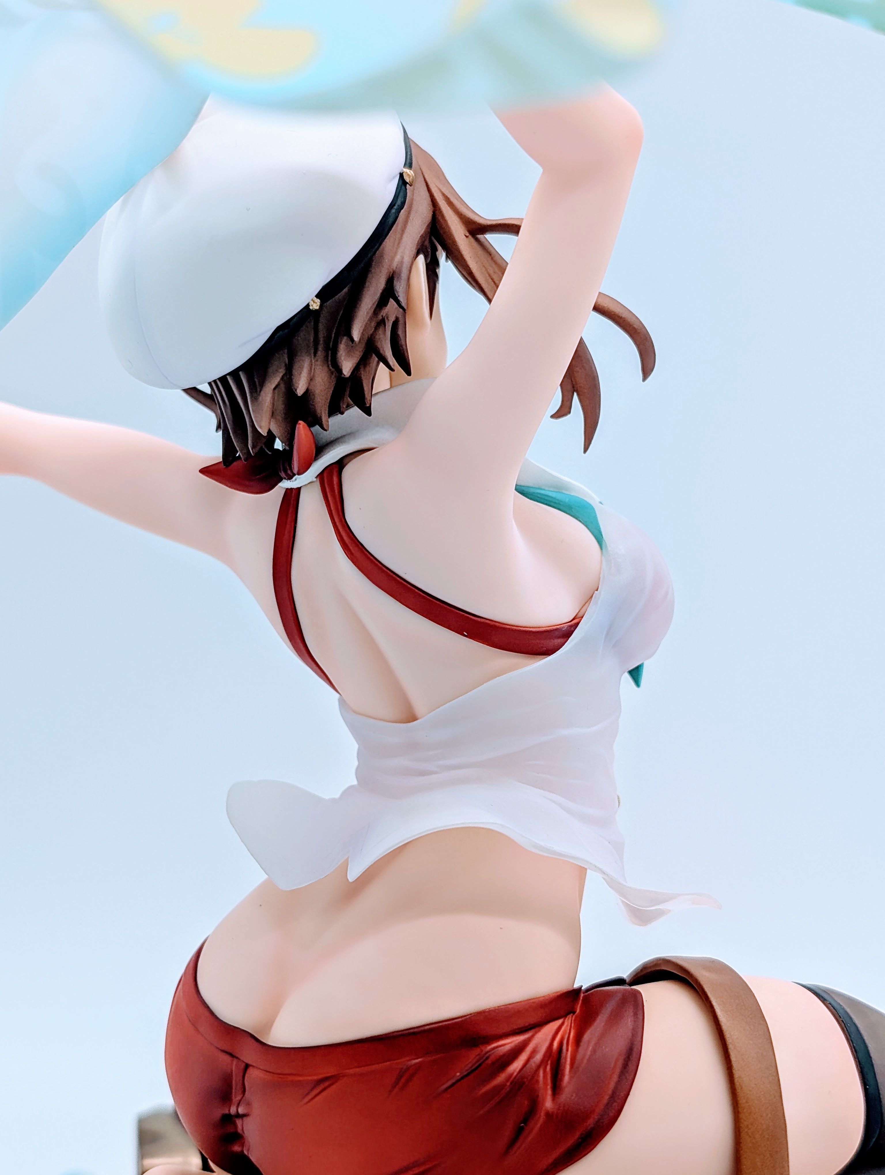 Back close-up of Ryza legs, bare foot and boot on sandy base