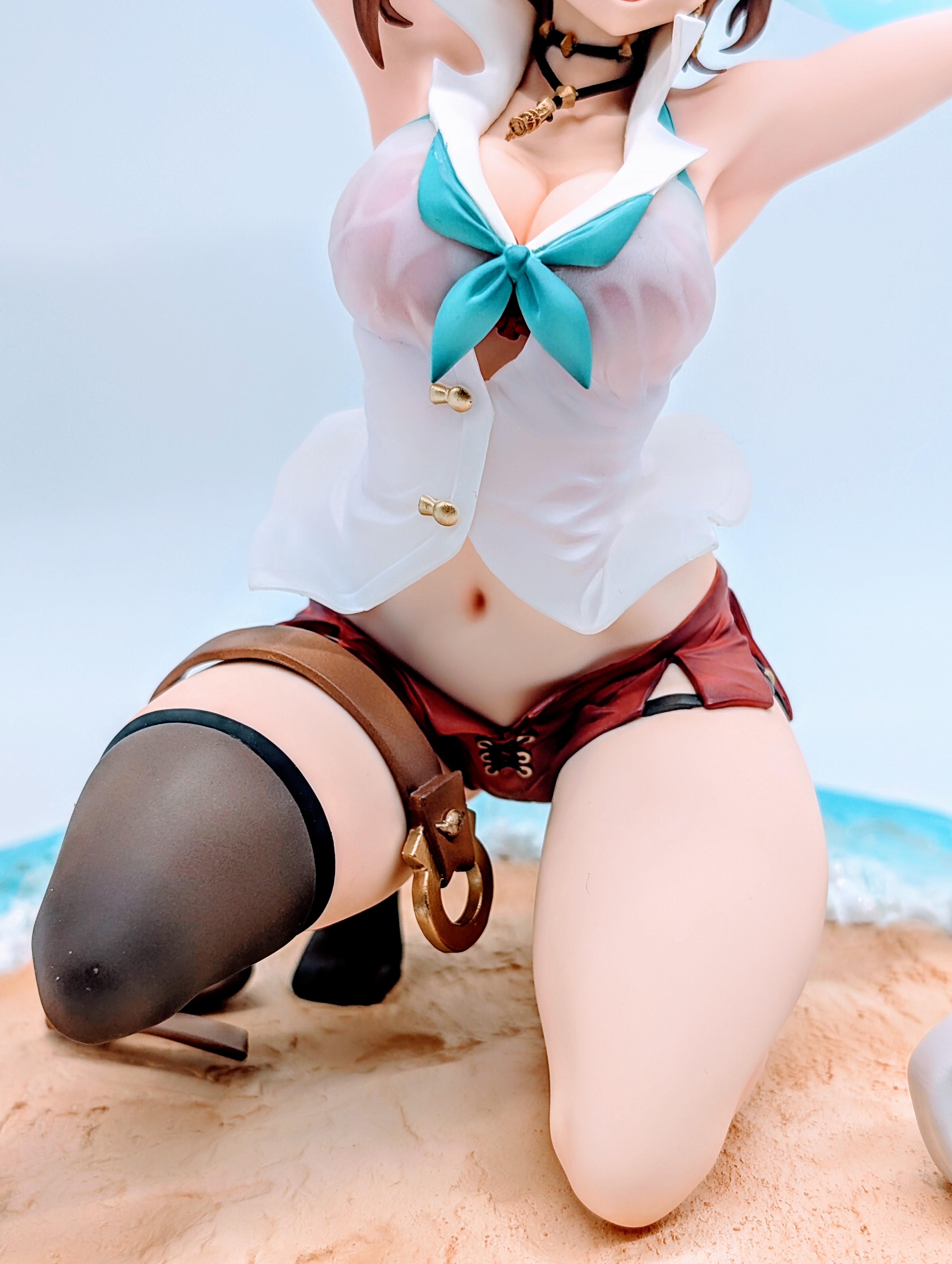 High angle close-up of Ryza face looking up with big smile