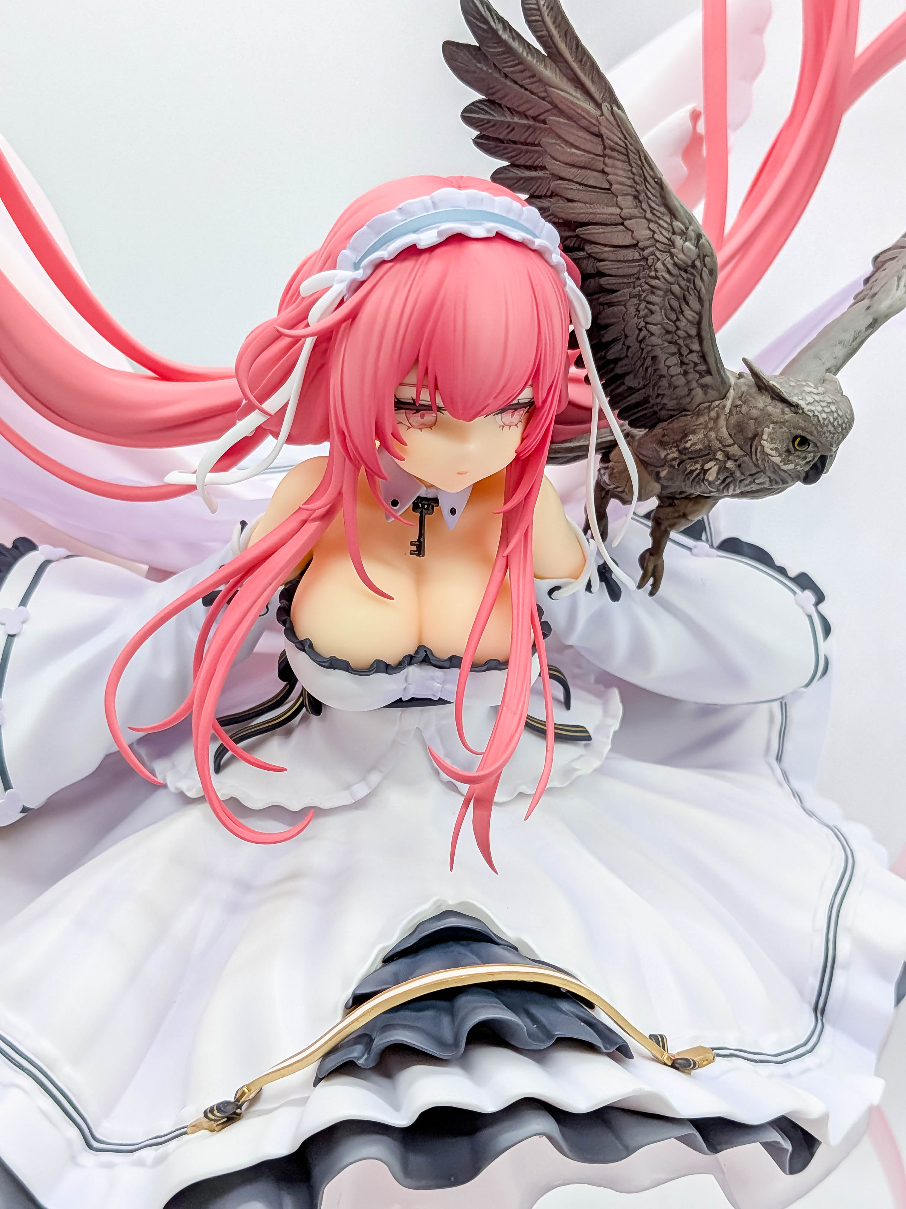 Perseus figure face pink hair and owl close-up