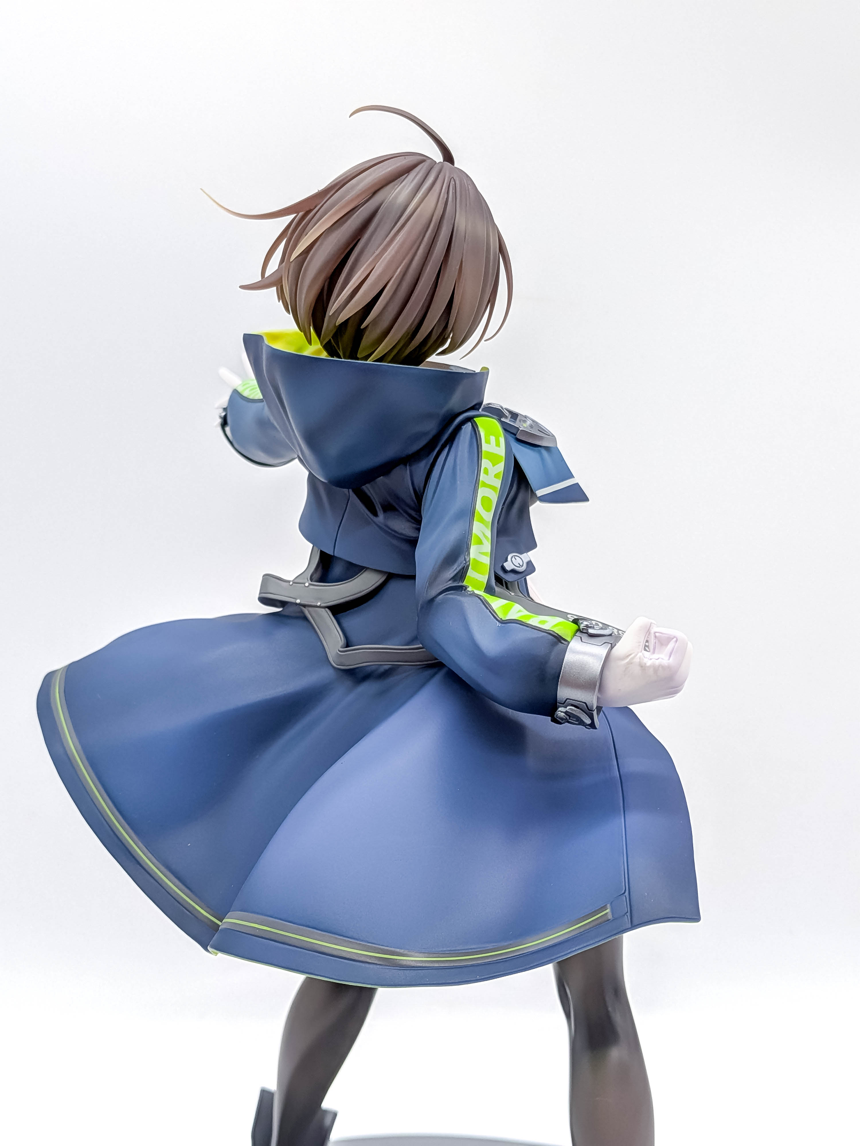 Baltimore figure rear hair hood and navy coat close-up