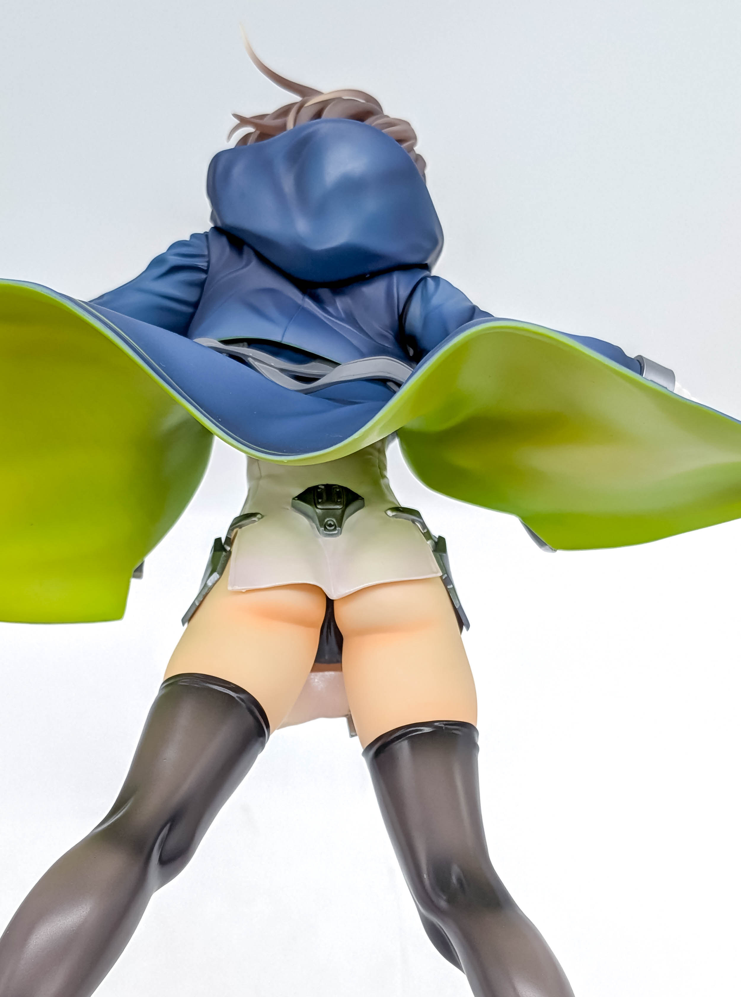 Baltimore figure low rear view showing coat hips and thigh-high stockings