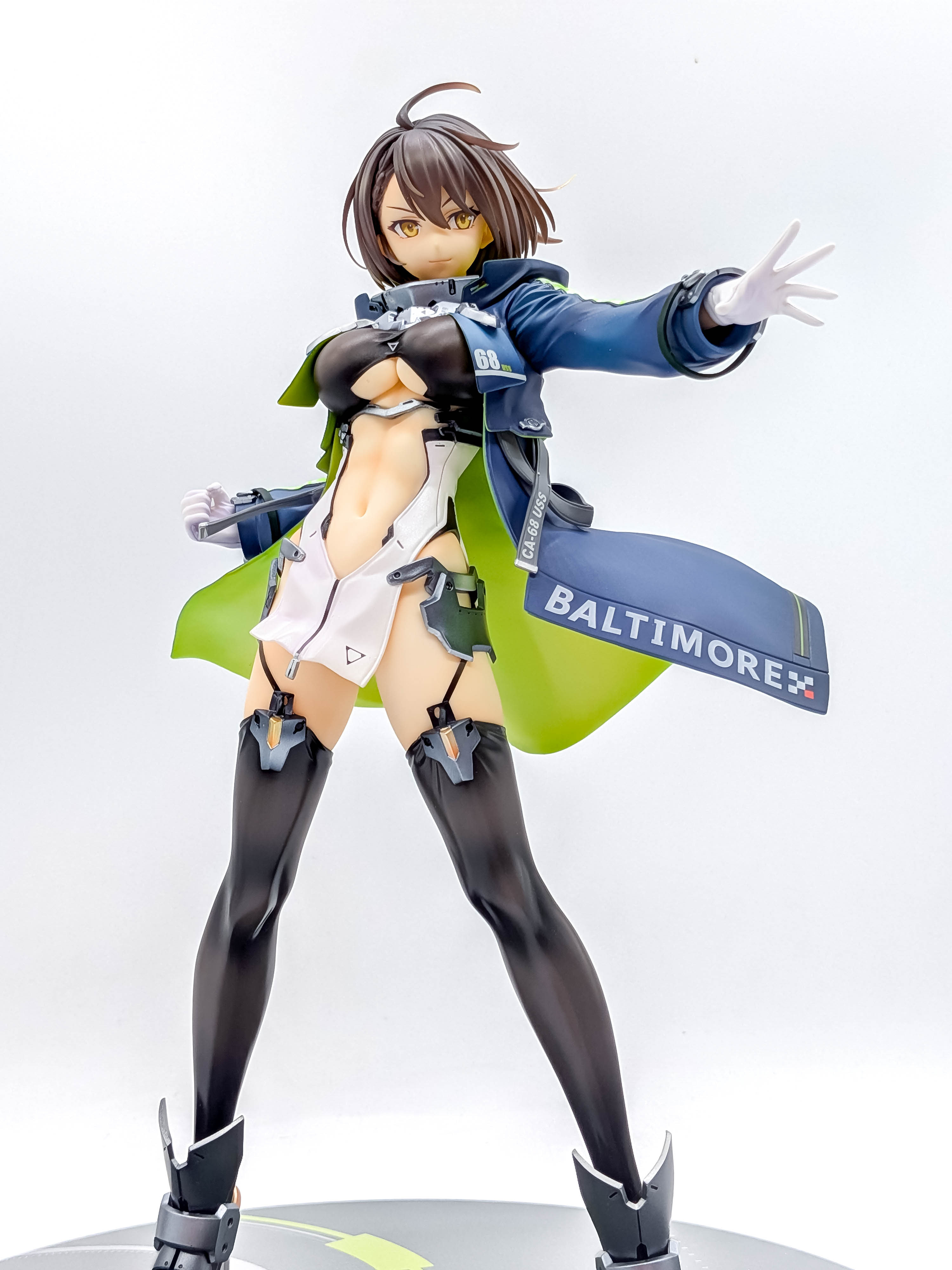 Baltimore figure full front body view with navy coat and thigh-high stockings