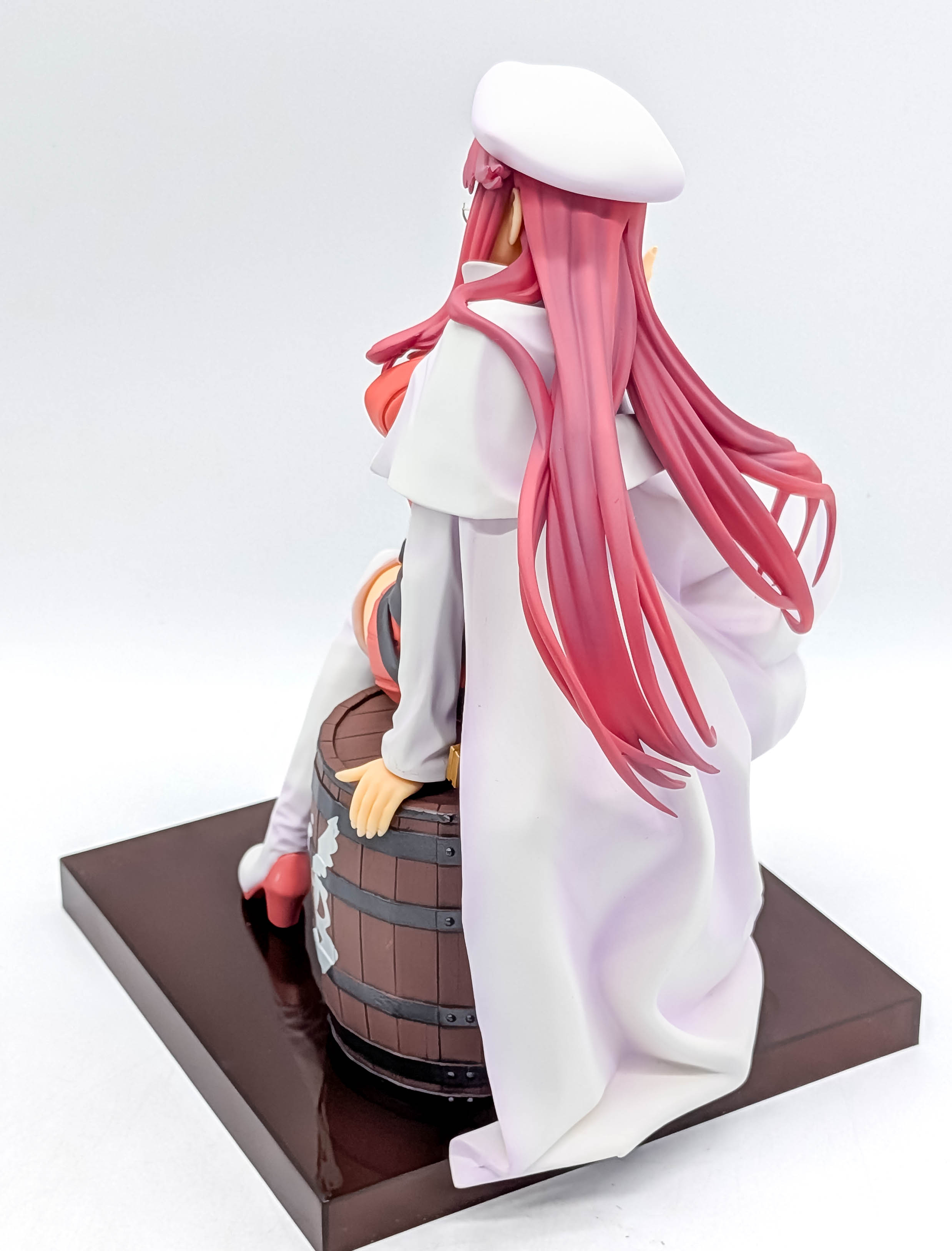 Aty figure rear-side view with long pink hair and white coat