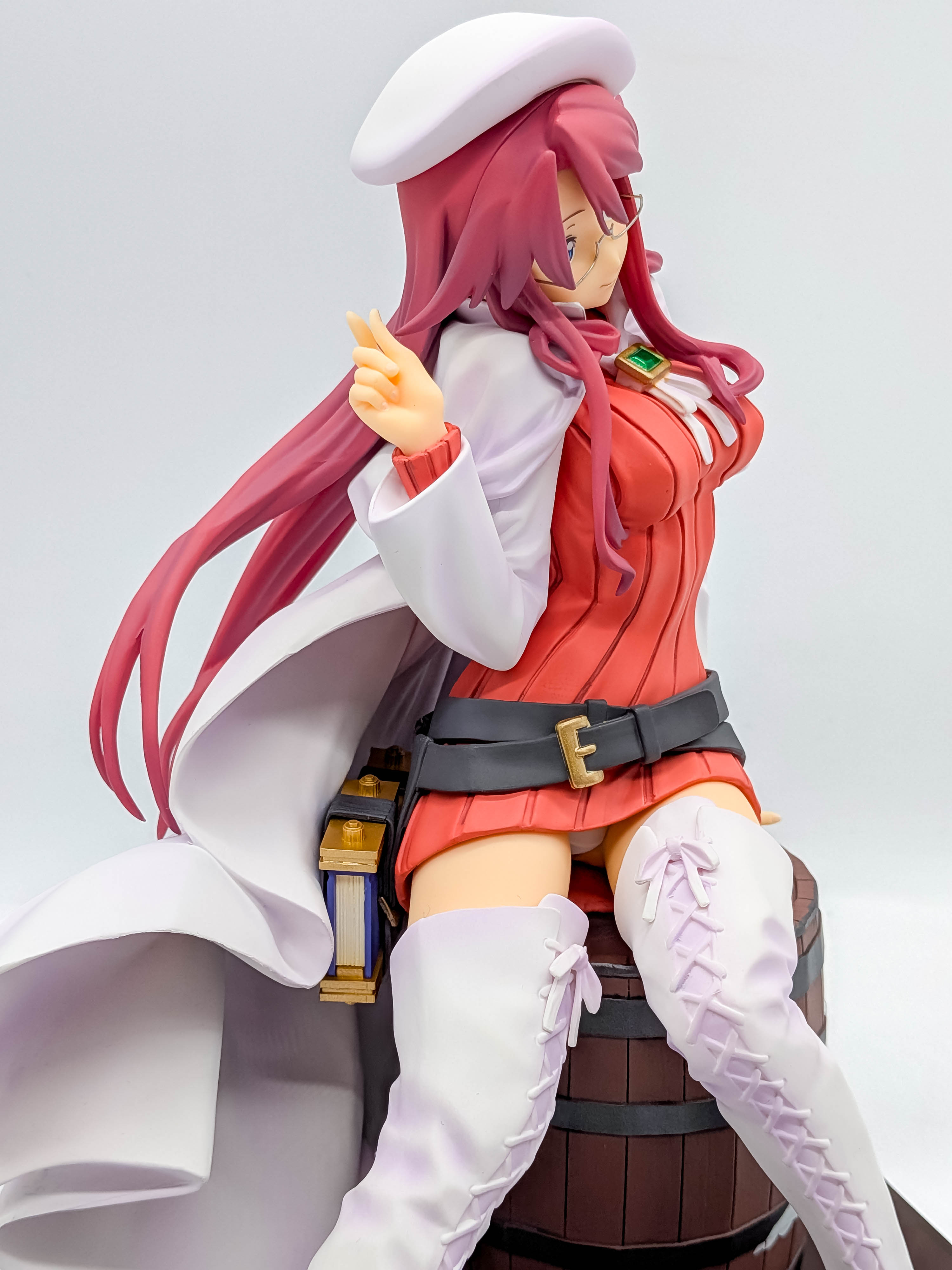 Aty figure three-quarter view with white coat and belts