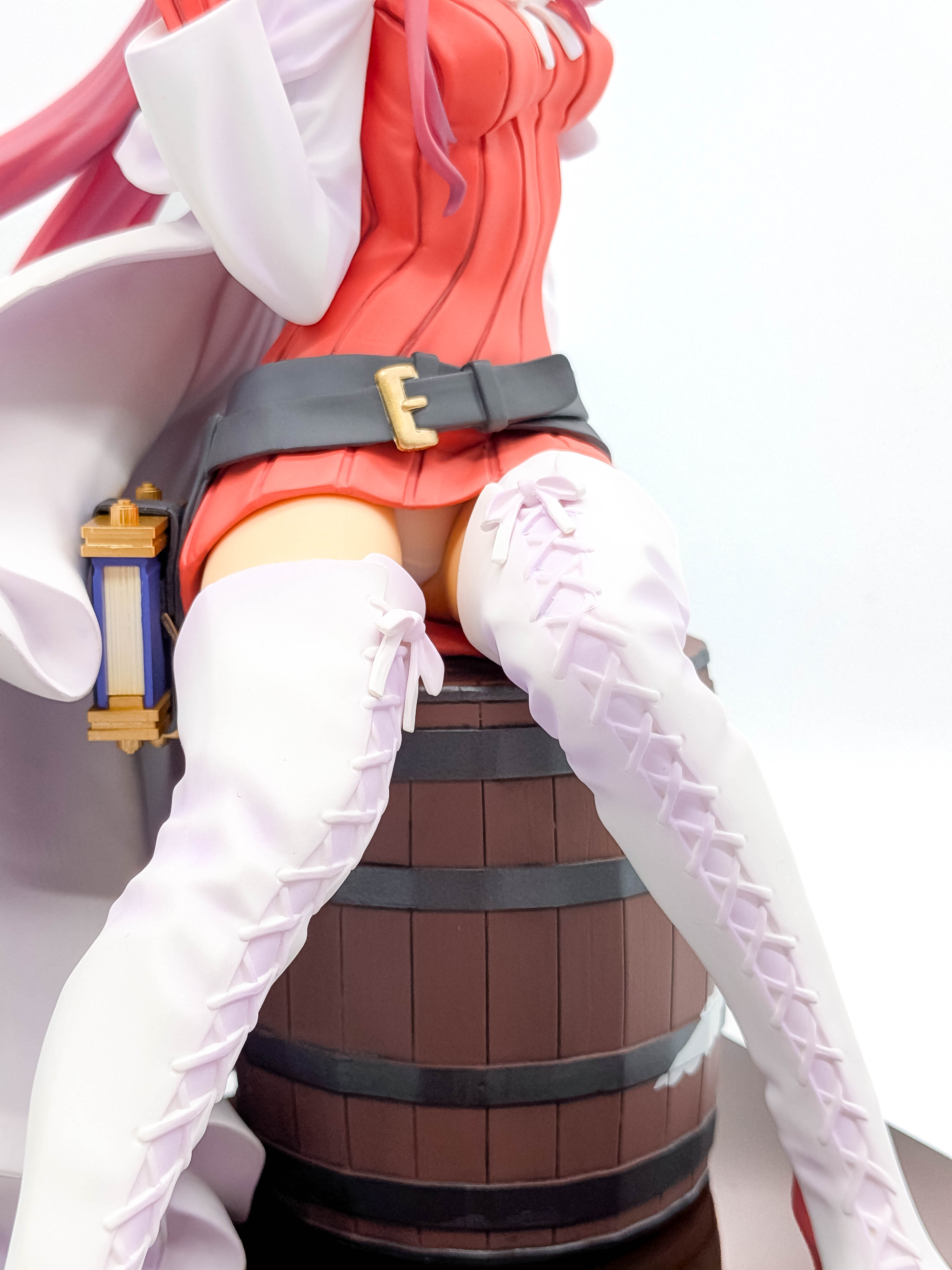 Aty figure thighs belts and white lace-up boots close-up