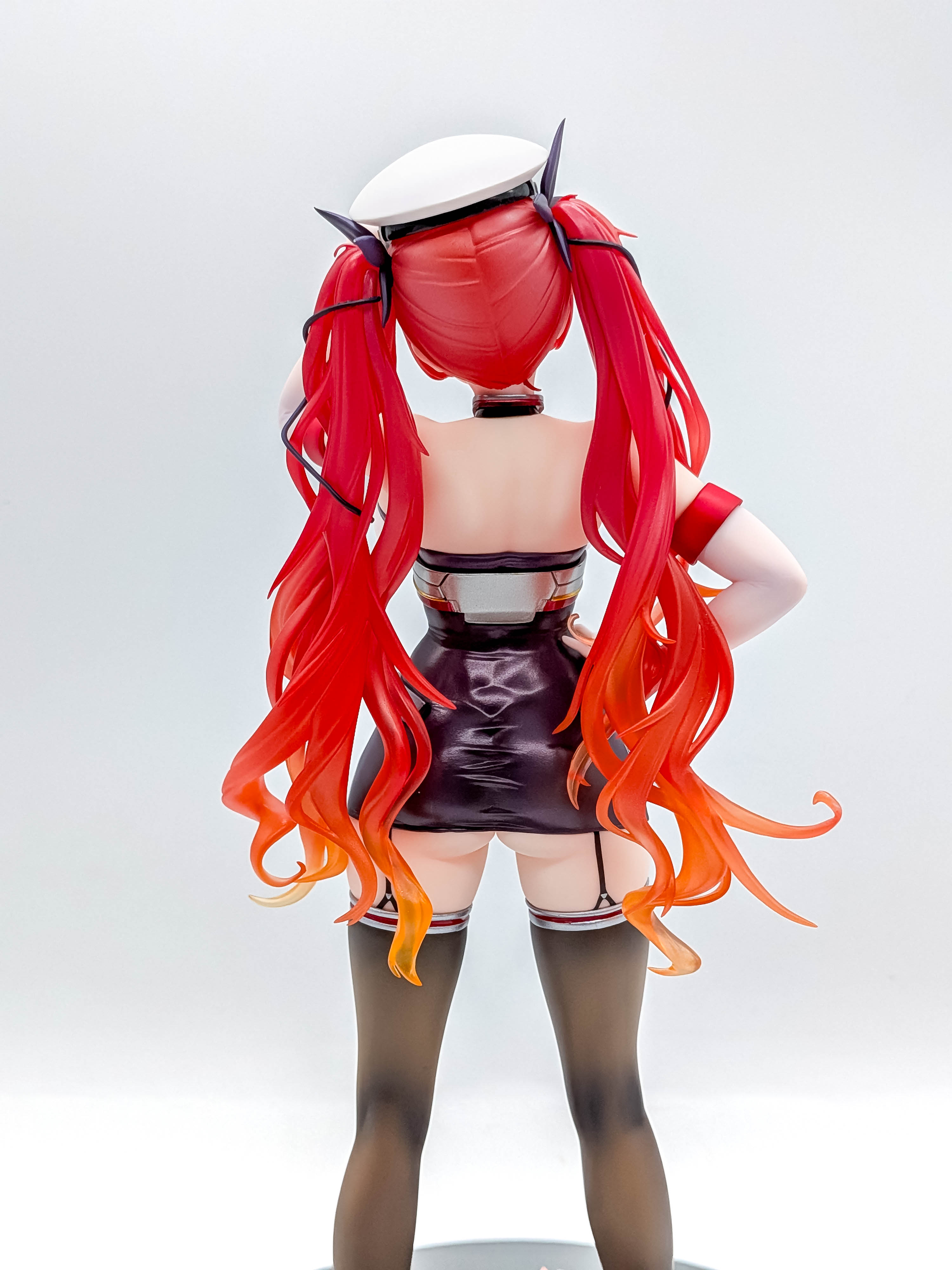 Rear close-up of Honolulu twin-tails, bare back and fitted uniform