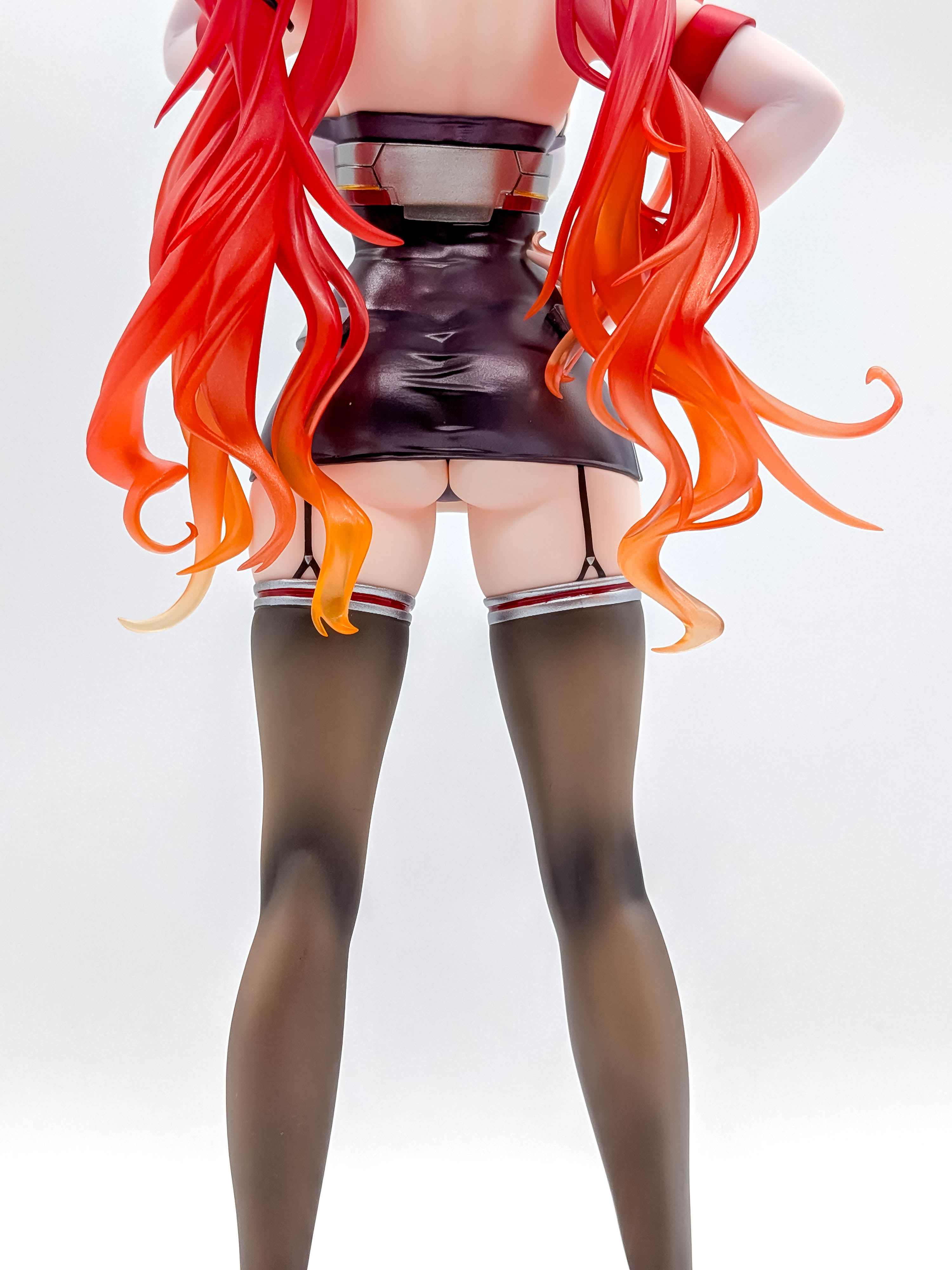 Rear close-up of Honolulu hips, short uniform and thigh-high stockings