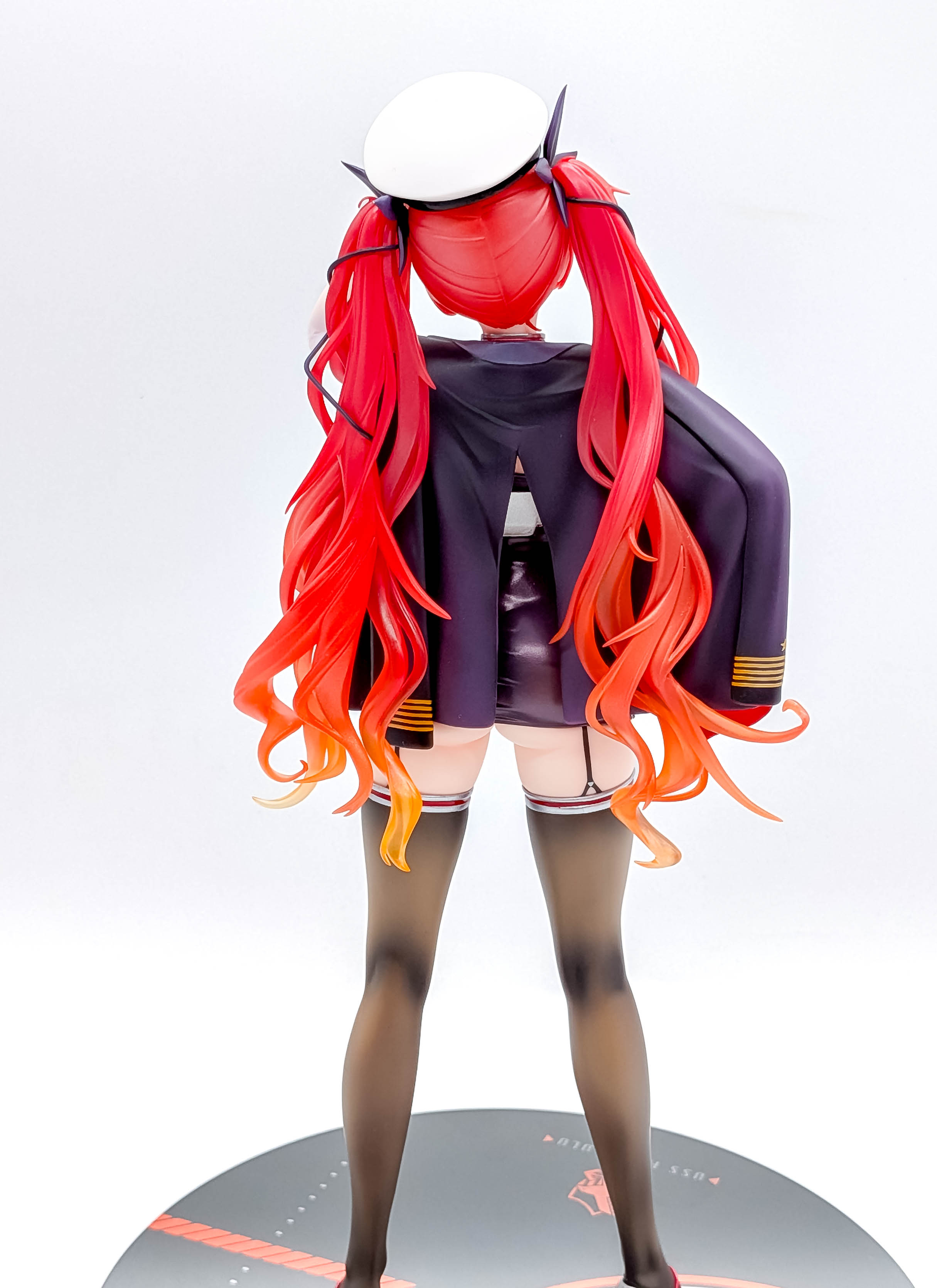 Honolulu rear view with navy jacket and flowing twin-tails