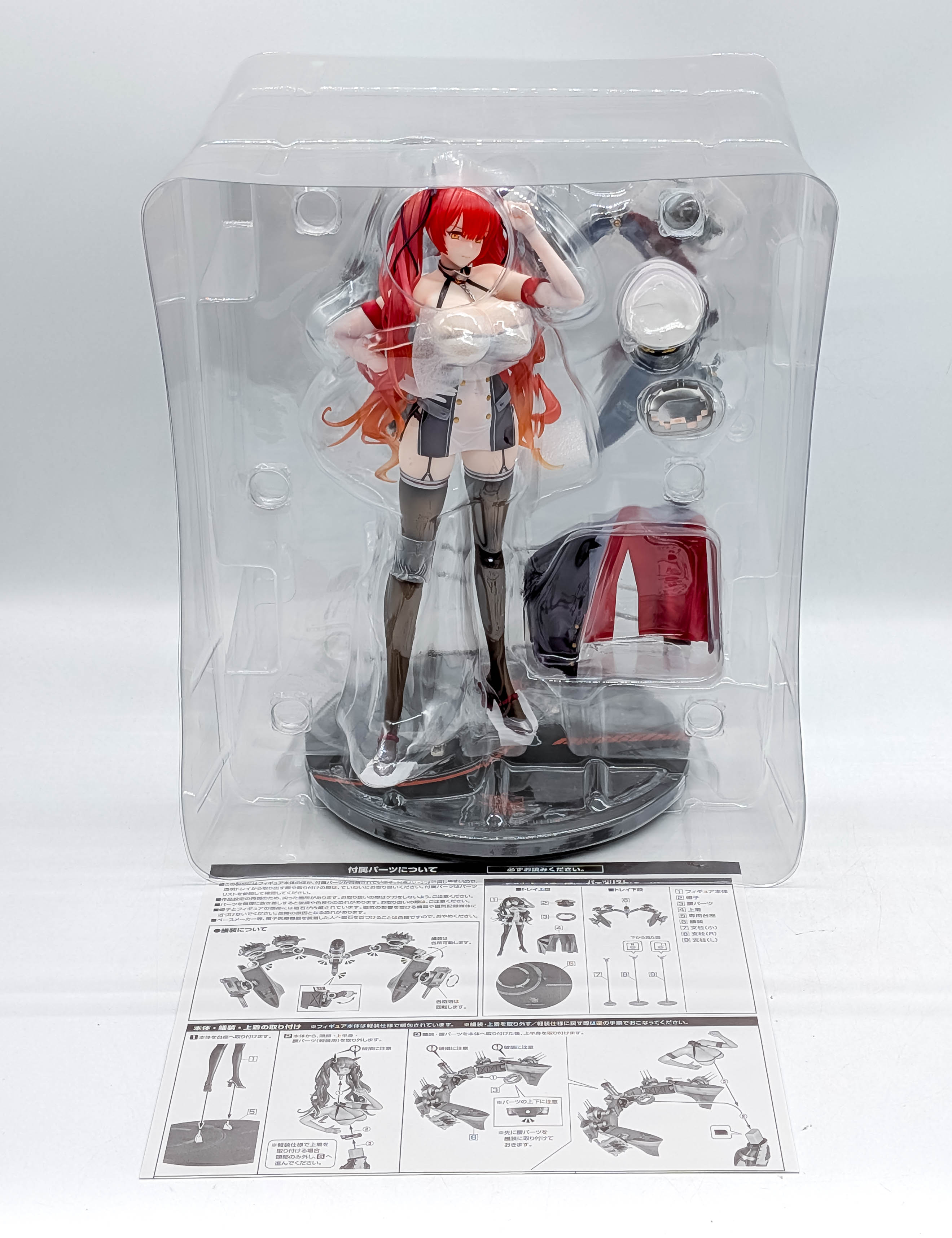 Honolulu figure, removable jacket, rigging, base and instructions inside blister packaging