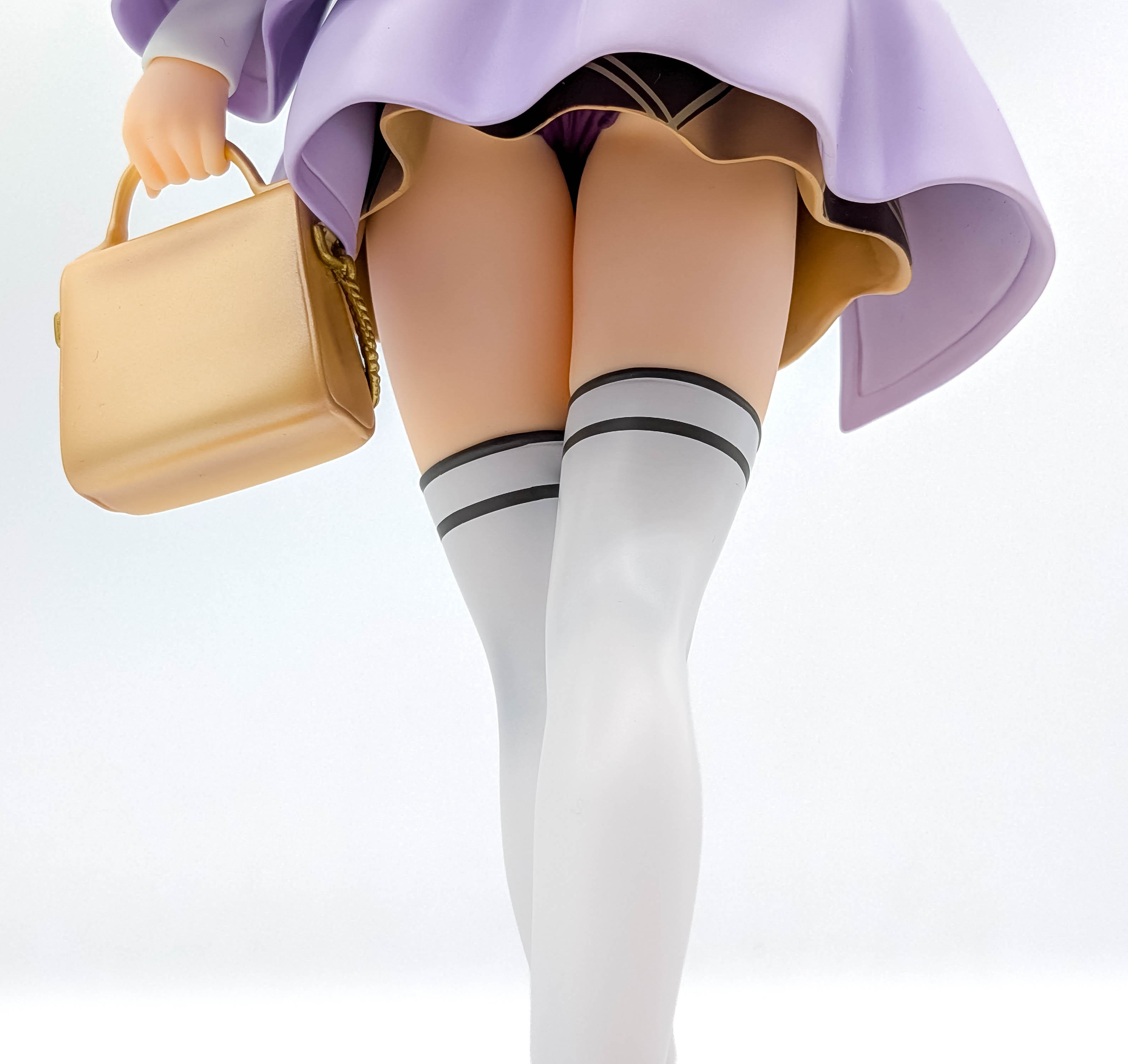 Nino Nakano figure low-angle dress socks and handbag detail