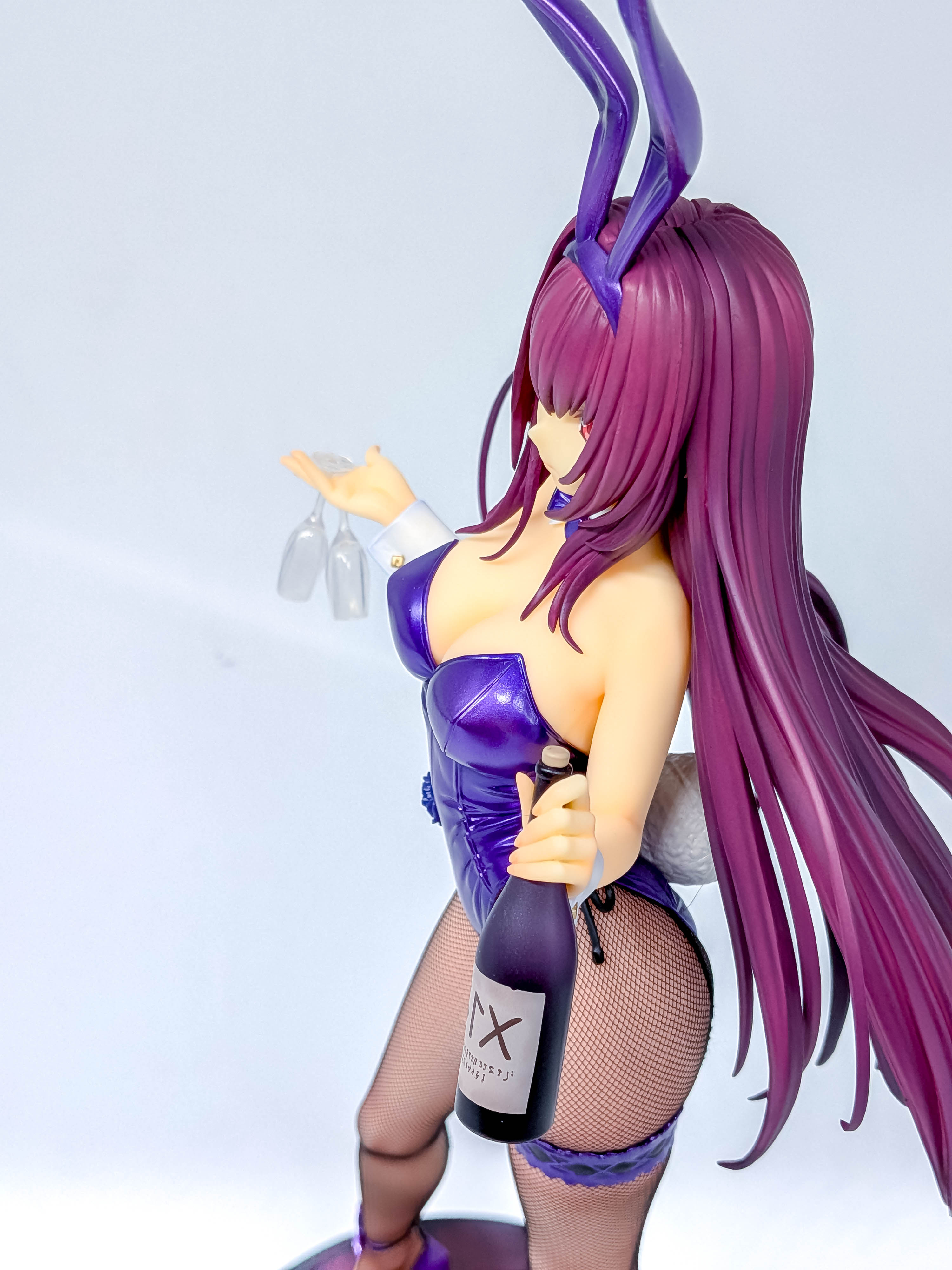 Rear three-quarter view emphasizing the hips, stockings and layered hair