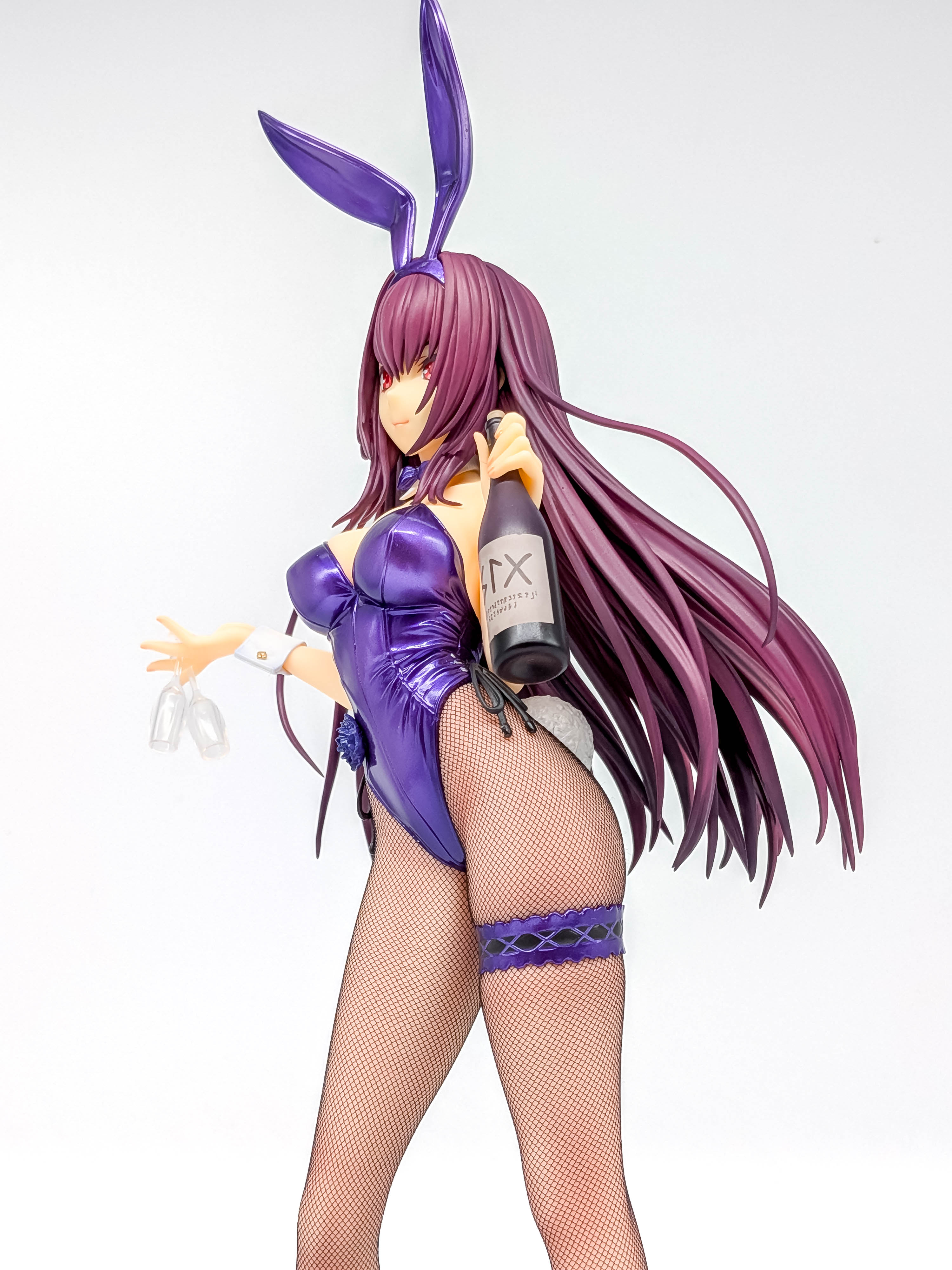 Low three-quarter angle emphasizing the tall silhouette and flowing hair