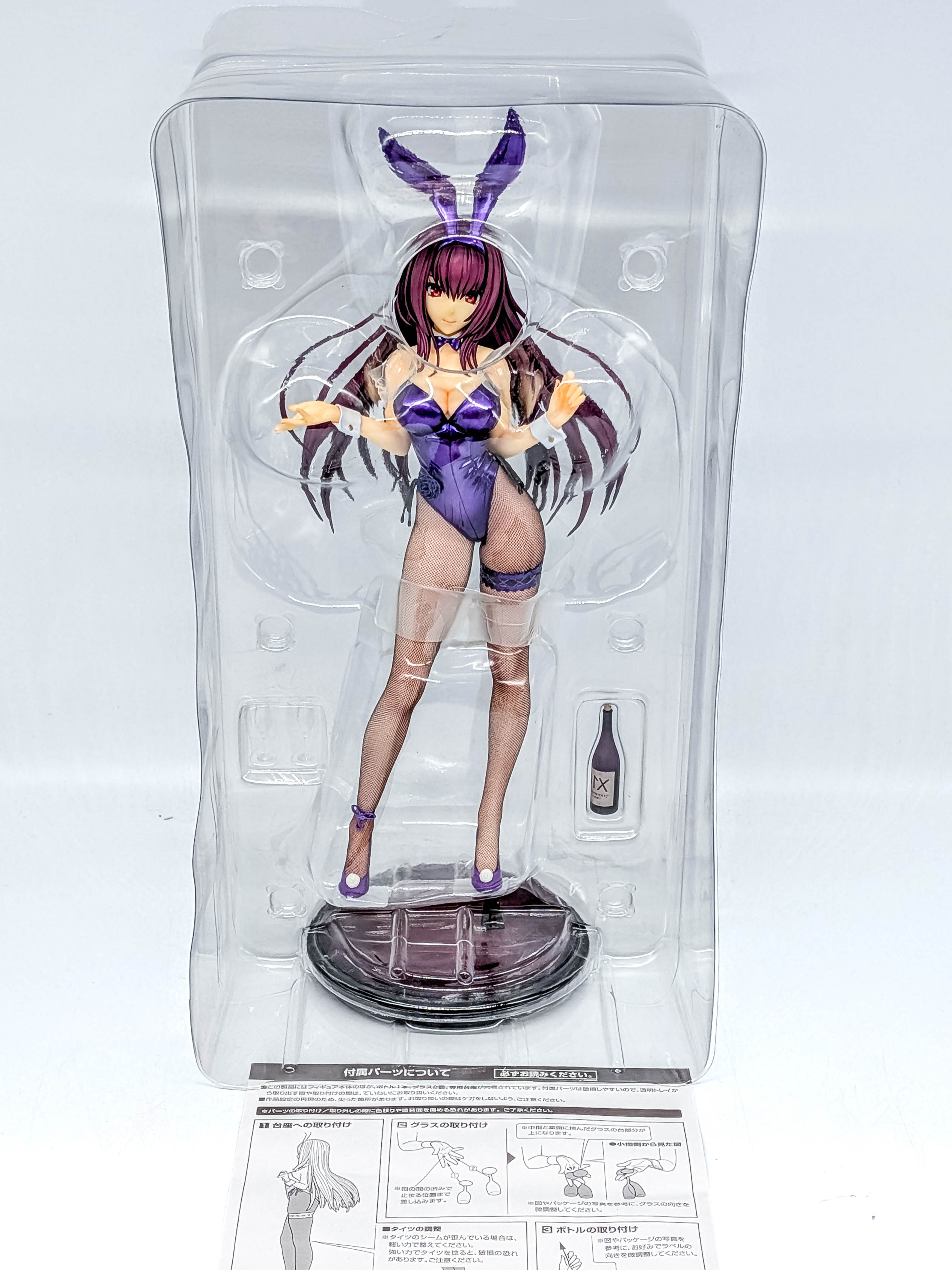 Figure and accessories secured inside clear blister packaging