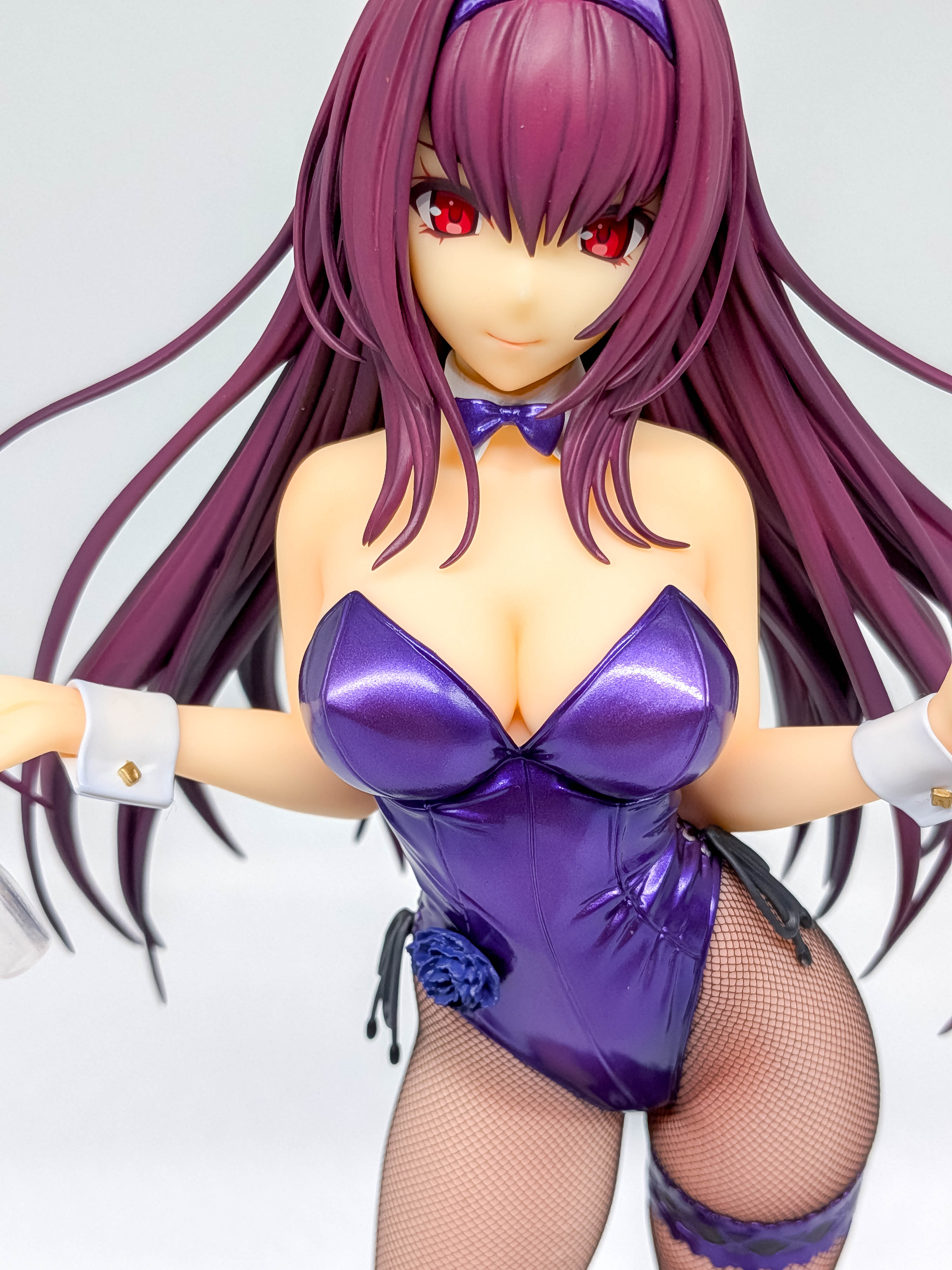 Scathach figure face with red eyes and dark purple hair