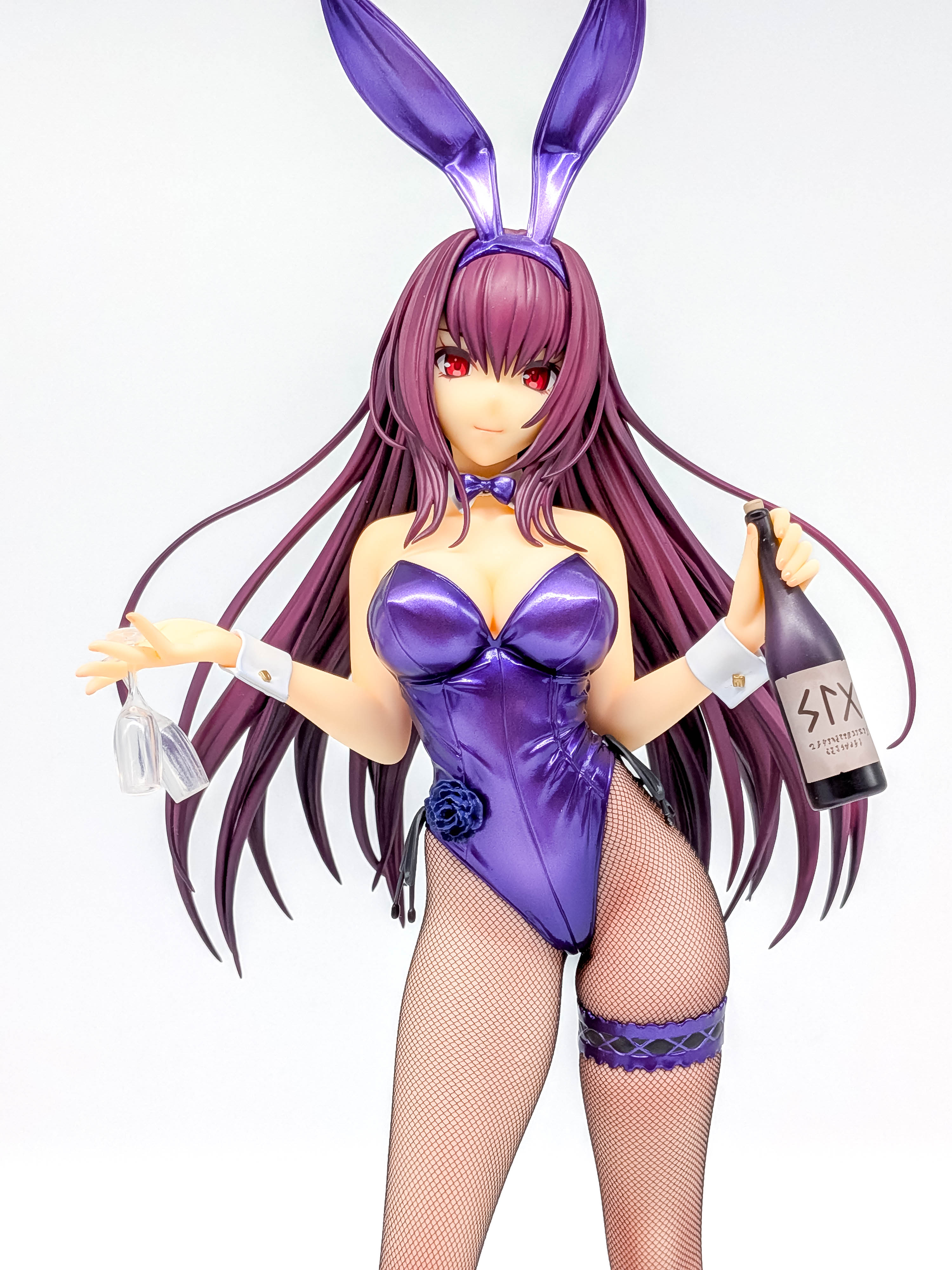 Metallic purple bunny suit and upper-body sculpt close-up