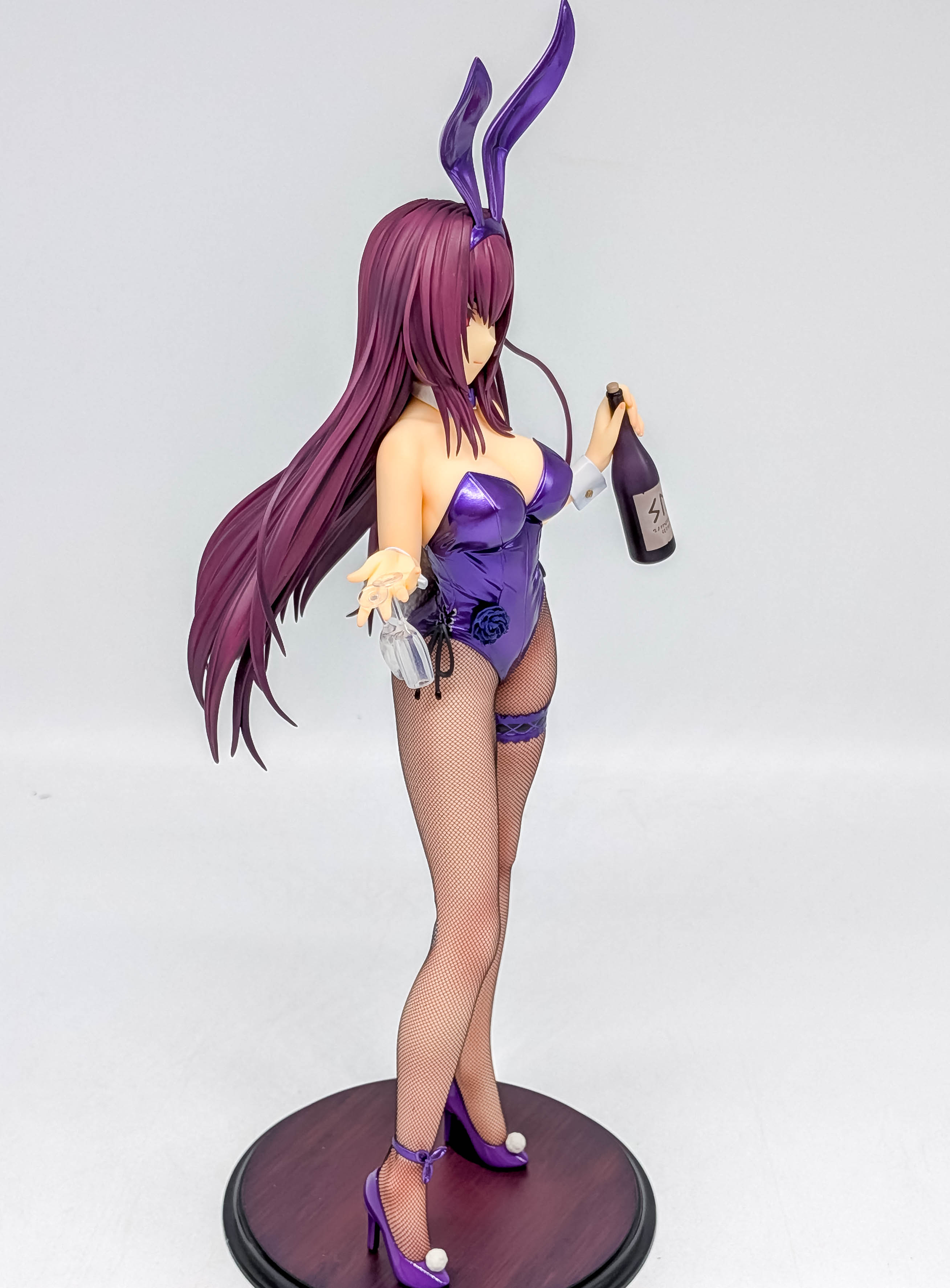 Full side profile showing long legs, high heels and flowing hair