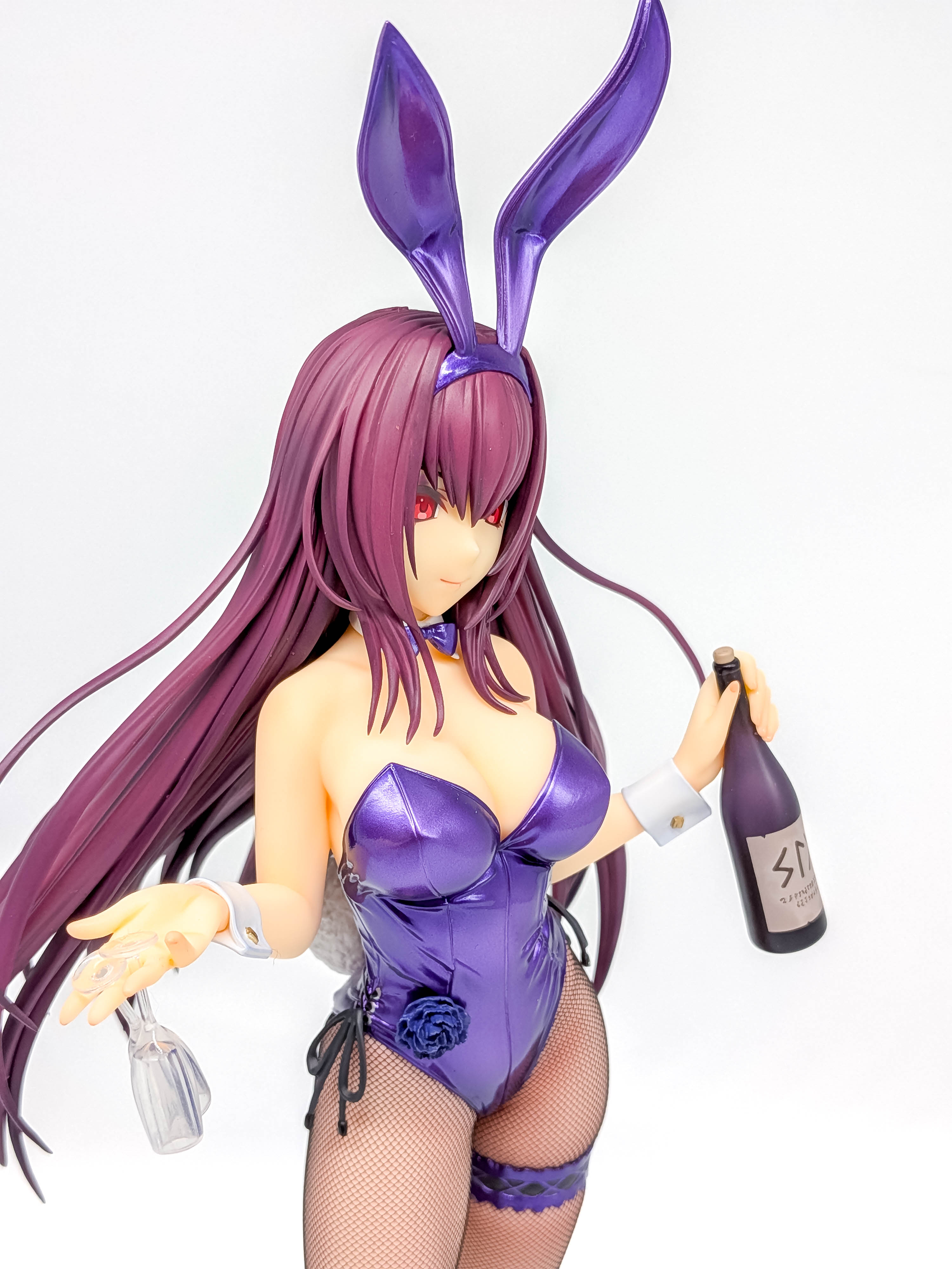 Wine bottle, two glasses and purple costume details
