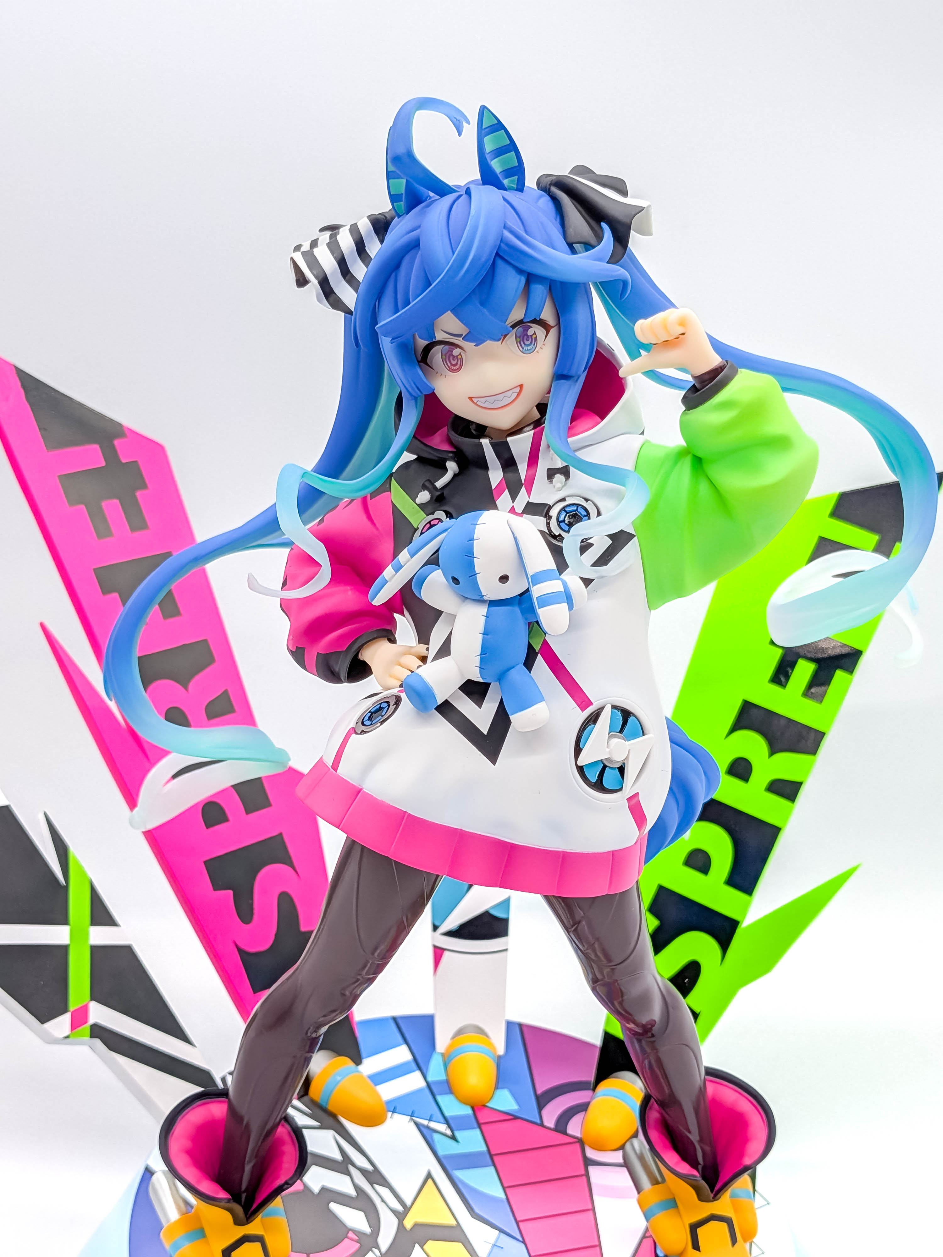 Twin Turbo figure closer front view with racewear and plush mascot
