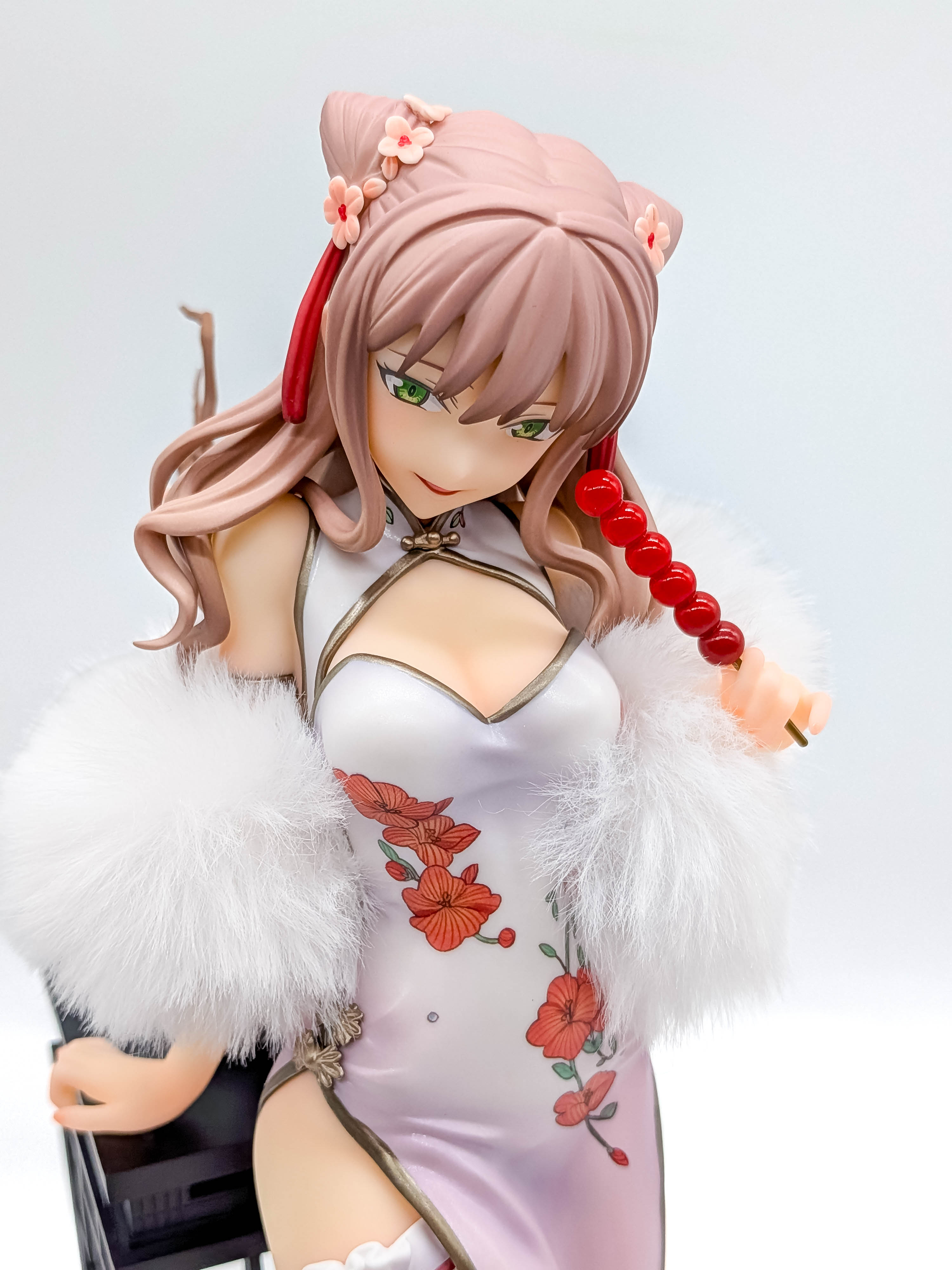 Yume Minami figure face green eyes and candied-fruit skewer close-up